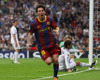 MADRID, SPAIN - APRIL 27: Lionel Messi of Barcelona celebrates after scoring his first goal during the UEFA Champions League Semi Final first leg match between Real Madrid and Barcelona at Estadio Santiago Bernabeu on April 27, 2011 in Madrid, Spain. (Pho