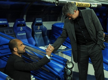 MADRID, SPAIN - APRIL 16: Barcelona manager (L) Josep Guardiola shakes hands with head coach Jose Mourinho of Real Madrid before the start of the La Liga match between Real Madrid and Barcelona at Estadio Santiago Bernabeu on April 16, 2011 in Madrid, Spa
