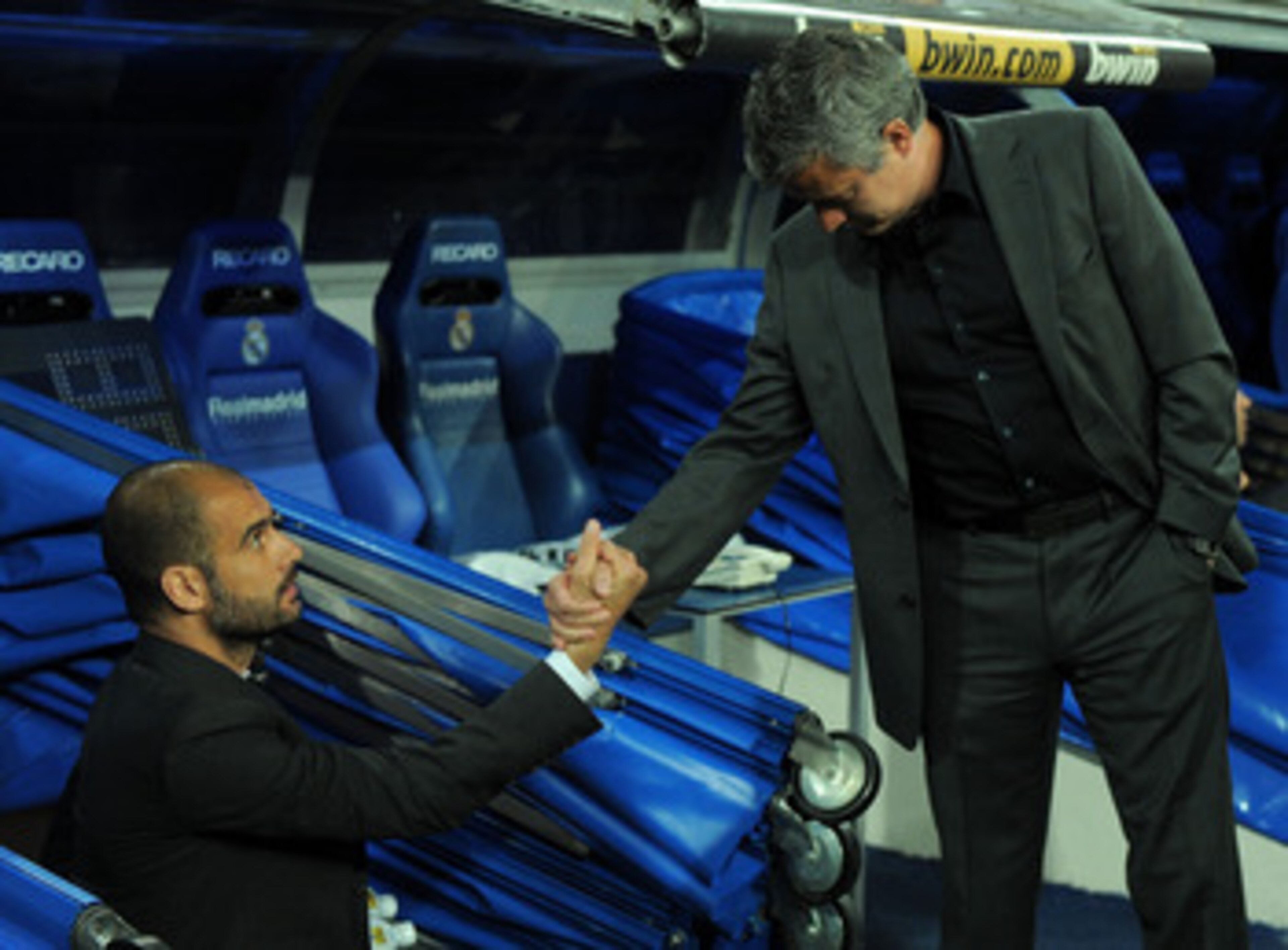MADRID, SPAIN - APRIL 16: Barcelona manager (L) Josep Guardiola shakes hands with head coach Jose Mourinho of Real Madrid before the start of the La Liga match between Real Madrid and Barcelona at Estadio Santiago Bernabeu on April 16, 2011 in Madrid, Spa