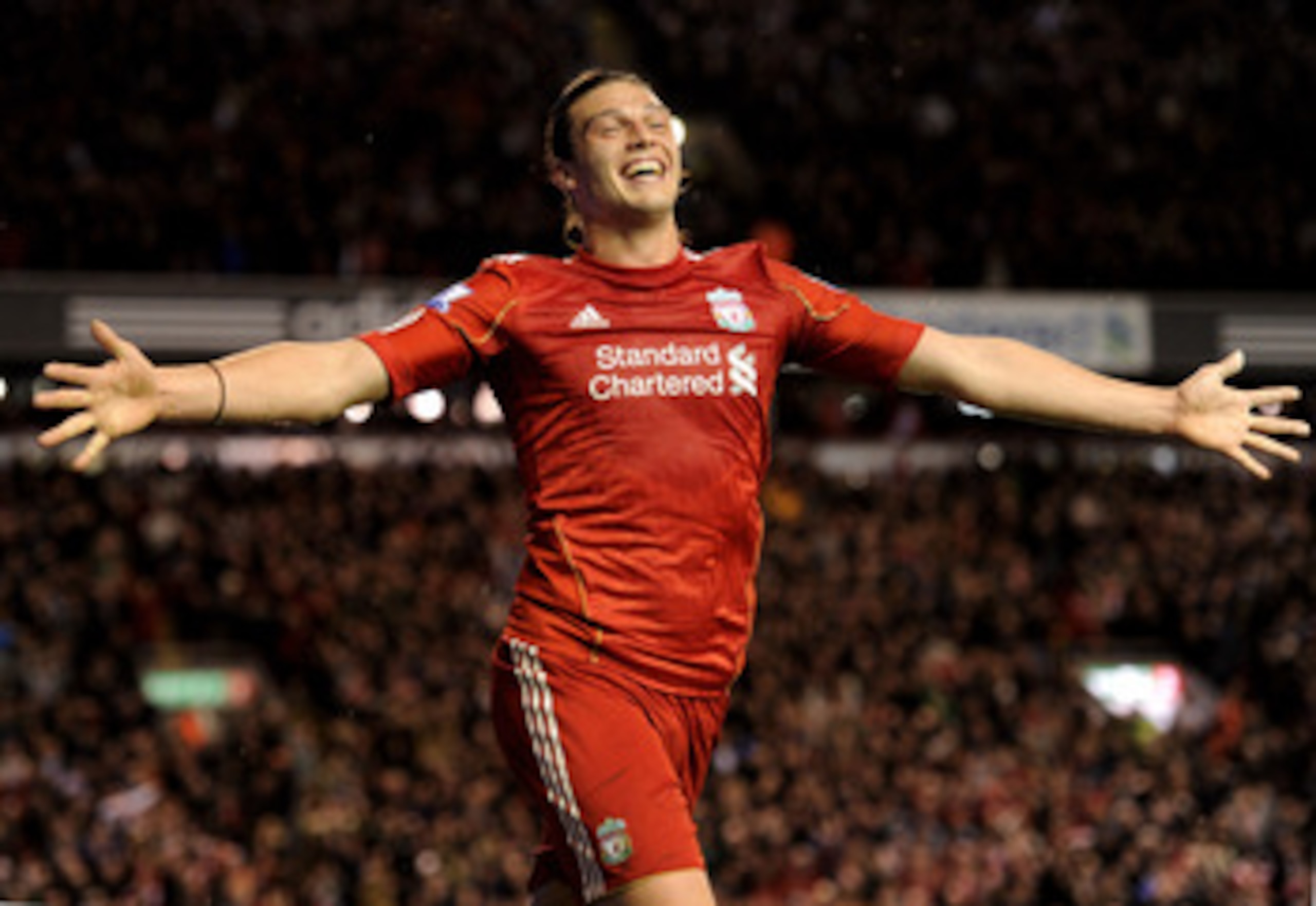 LIVERPOOL, ENGLAND - APRIL 11:  Andy Carroll of Liverpool celebrates scoring his team's third goal during the Barclays Premier League match between Liverpool and Manchester City at Anfield on April 11, 2011 in Liverpool, England.  (Photo by Michael Regan/