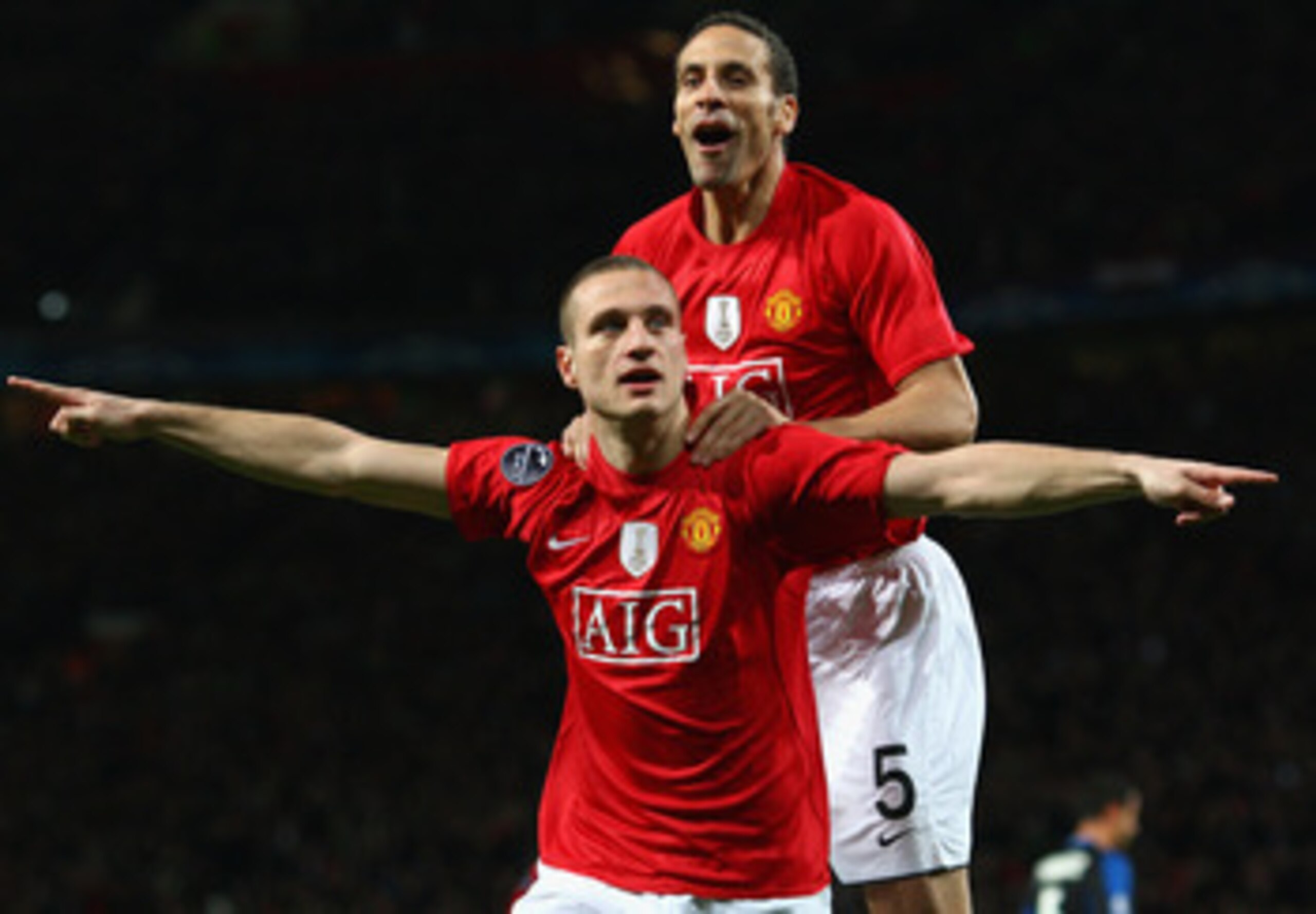 MANCHESTER, UNITED KINGDOM - MARCH 11:  Nemanja Vidic of Manchester United celebrates scoring the opening goal with team mate Rio Ferdinand (R) during the UEFA Champions League Round of Sixteen, Second Leg match between Manchester United and Inter Milan a