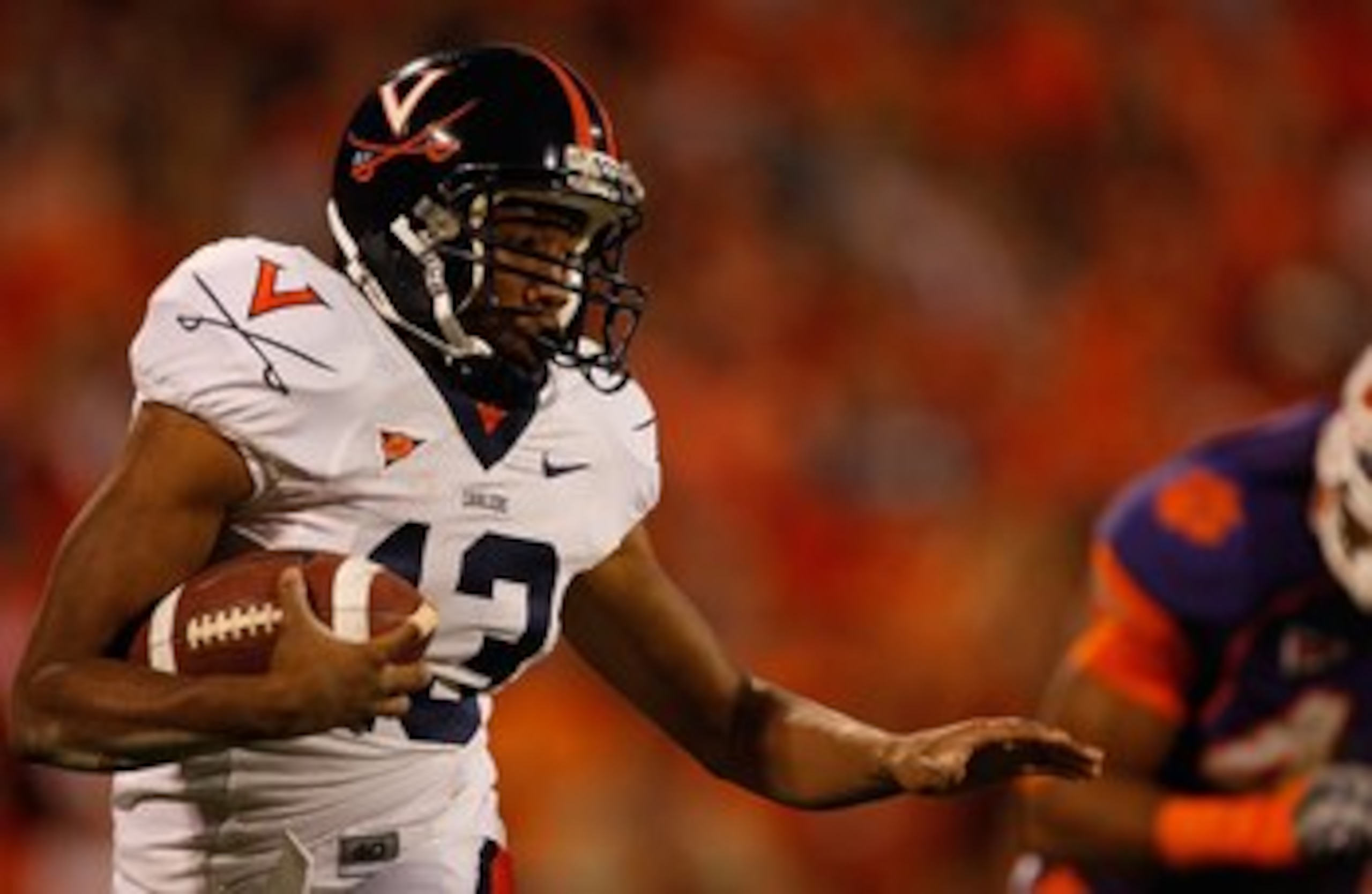 CLEMSON, SC - NOVEMBER 21: Chase Minnifield #13 of the Virginia Cavaliers runs with the ball during the game against the Clemson Tigers at Memorial Stadium on November 21, 2009 in Clemson, South Carolina. (Photo by Streeter Lecka/Getty Images) CLEMSON, SC - NOVEMBER 21: Chase Minnifield #13 of the Virginia Cavaliers runs with the ball during the game against the Clemson Tigers at Memorial Stadium on November 21, 2009 in Clemson, South Carolina. (Photo by Streeter Lecka/Getty Images)