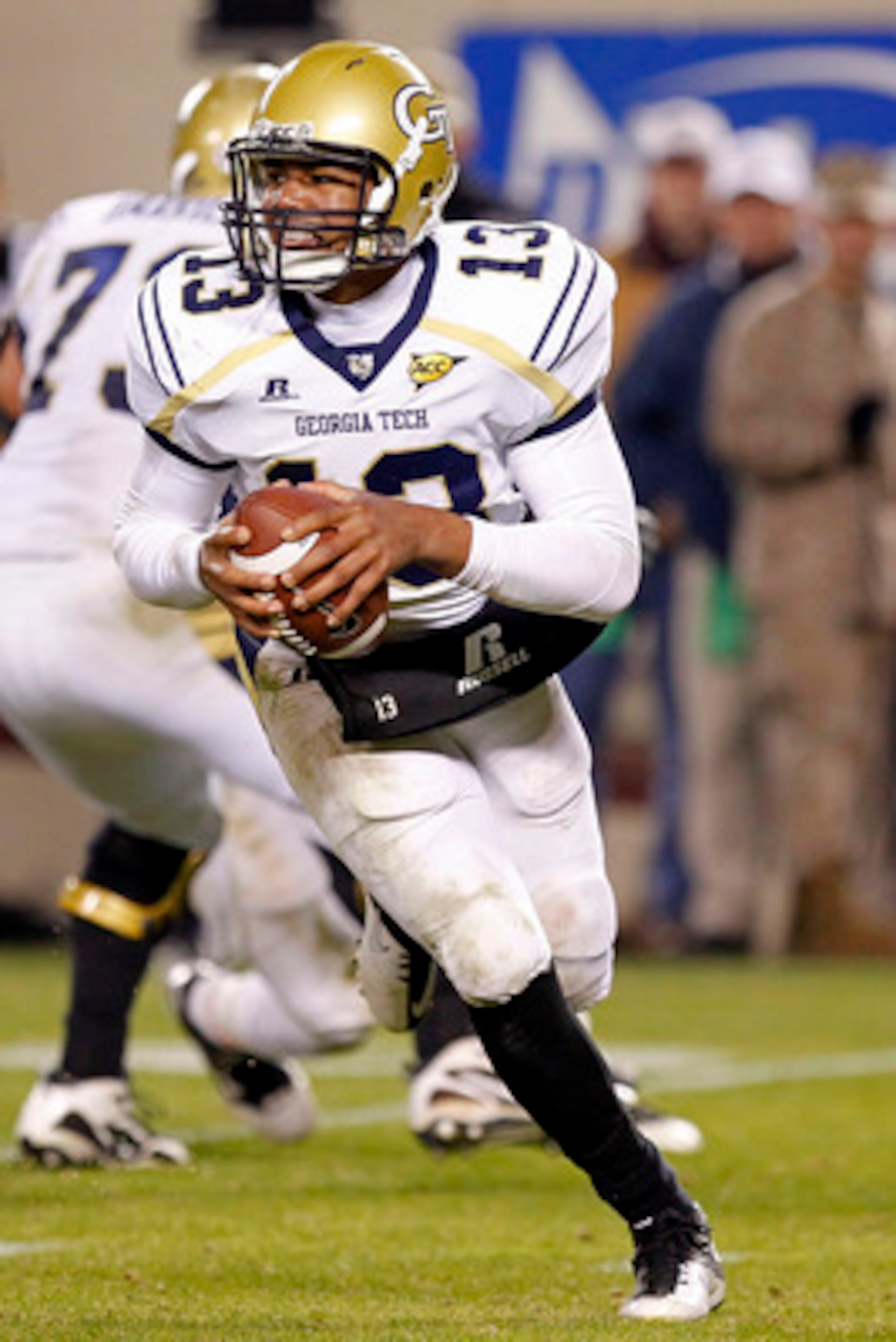 BLACKSBURG, VA - NOVEMBER 04: Quarterback Tevin Washington #13 of the Georgia Tech Yellow Jackets runs with the ball against the Virginia Tech Hokies at Lane Stadium on November 4, 2010 in Blacksburg, Virginia. (Photo by Geoff Burke/Getty Images) BLACKSBURG, VA - NOVEMBER 04: Quarterback Tevin Washington #13 of the Georgia Tech Yellow Jackets runs with the ball against the Virginia Tech Hokies at Lane Stadium on November 4, 2010 in Blacksburg, Virginia. (Photo by Geoff Burke/Getty Images)