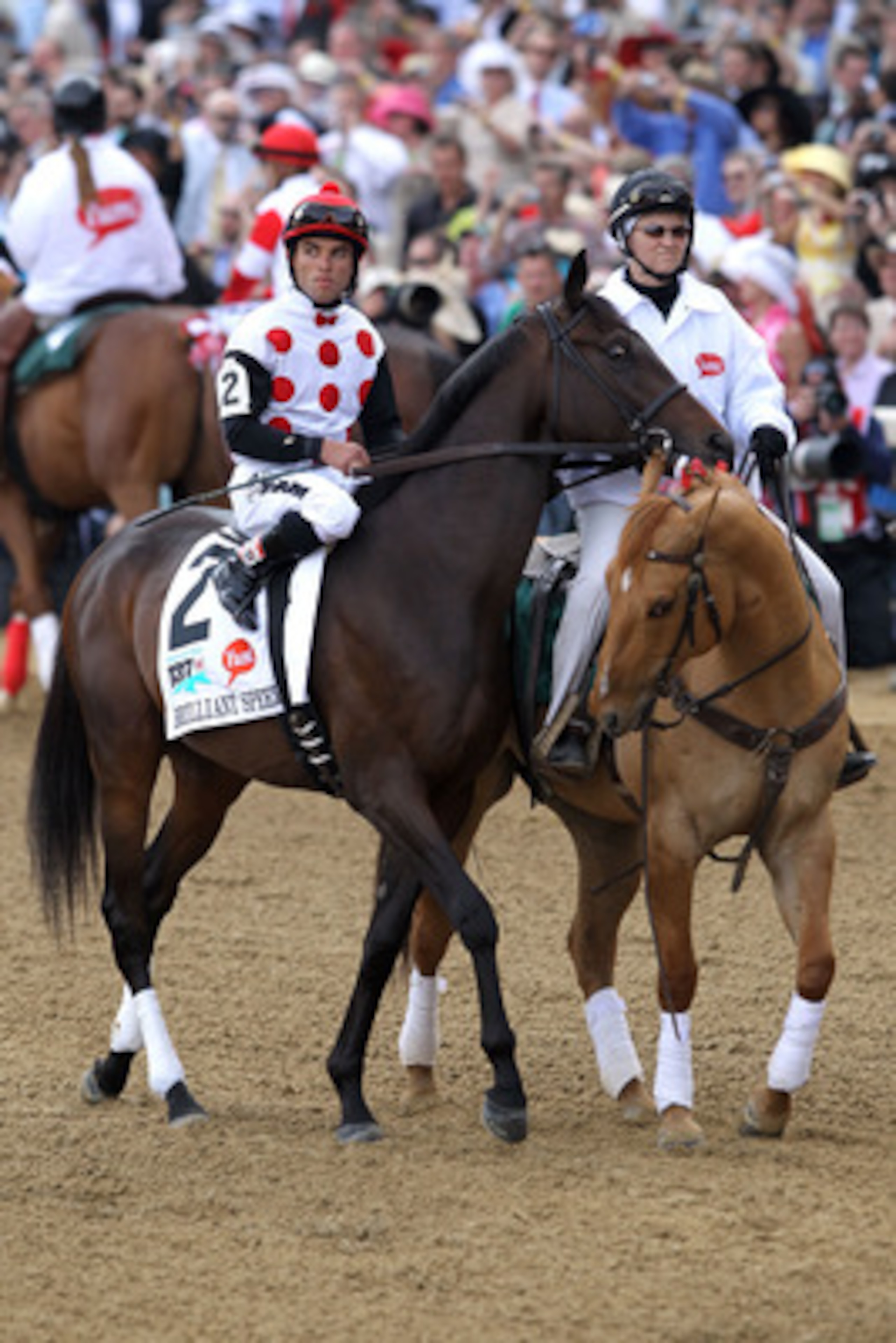 LOUISVILLE, KY - MAY 07:  Jockey Joel Rosario, riding Brilliant Speed #2, is escourted onto the track by an outrider for the running of the 137th Kentucky Derby at Churchill Downs on May 7, 2011 in Louisville, Kentucky.  (Photo by Matthew Stockman/Getty I