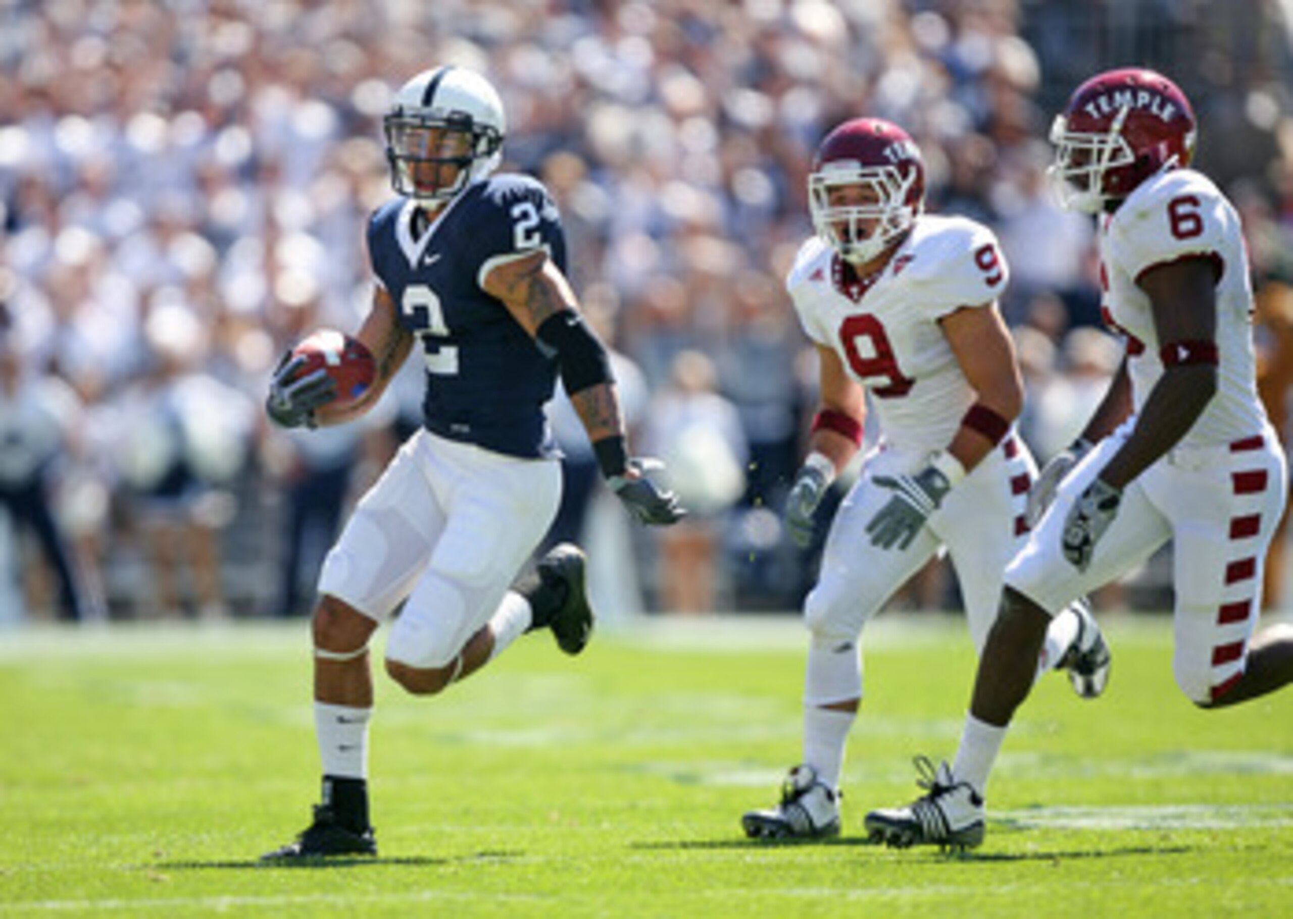 STATE COLLEGE, PA - SEPTEMBER 19: Wide receiver Chaz Powell #2 of the Penn State Nittany Lions runs with the ball after catching a pass as cornerback Anthony Ferla #9 and cornerback Dominique Harris #6 of the Temple Owls pursue during a game on September