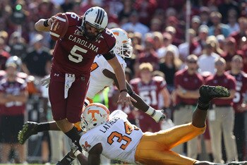 COLUMBIA, SC - OCTOBER 30: Stephen Garcia #5 of the South Carolina Gamecocks gets away from Herman Lathers #34 of the Tennessee Volunteers during their game at Williams-Brice Stadium on October 30, 2010 in Columbia, South Carolina. (Photo by Streeter Le COLUMBIA, SC - OCTOBER 30: Stephen Garcia #5 of the South Carolina Gamecocks gets away from Herman Lathers #34 of the Tennessee Volunteers during their game at Williams-Brice Stadium on October 30, 2010 in Columbia, South Carolina. (Photo by Streeter Le