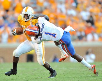 KNOXVILLE, TN - SEPTEMBER 18: Janoris Jenkins #1 of the Florida Gators fights to bring down Tauren Poole #28 of the Tennessee Volunteers at Neyland Stadium on September 18, 2010 in Knoxville, Tennessee. Florida won 31-17. (Photo by Grant Halverson/Getty KNOXVILLE, TN - SEPTEMBER 18: Janoris Jenkins #1 of the Florida Gators fights to bring down Tauren Poole #28 of the Tennessee Volunteers at Neyland Stadium on September 18, 2010 in Knoxville, Tennessee. Florida won 31-17. (Photo by Grant Halverson/Getty
