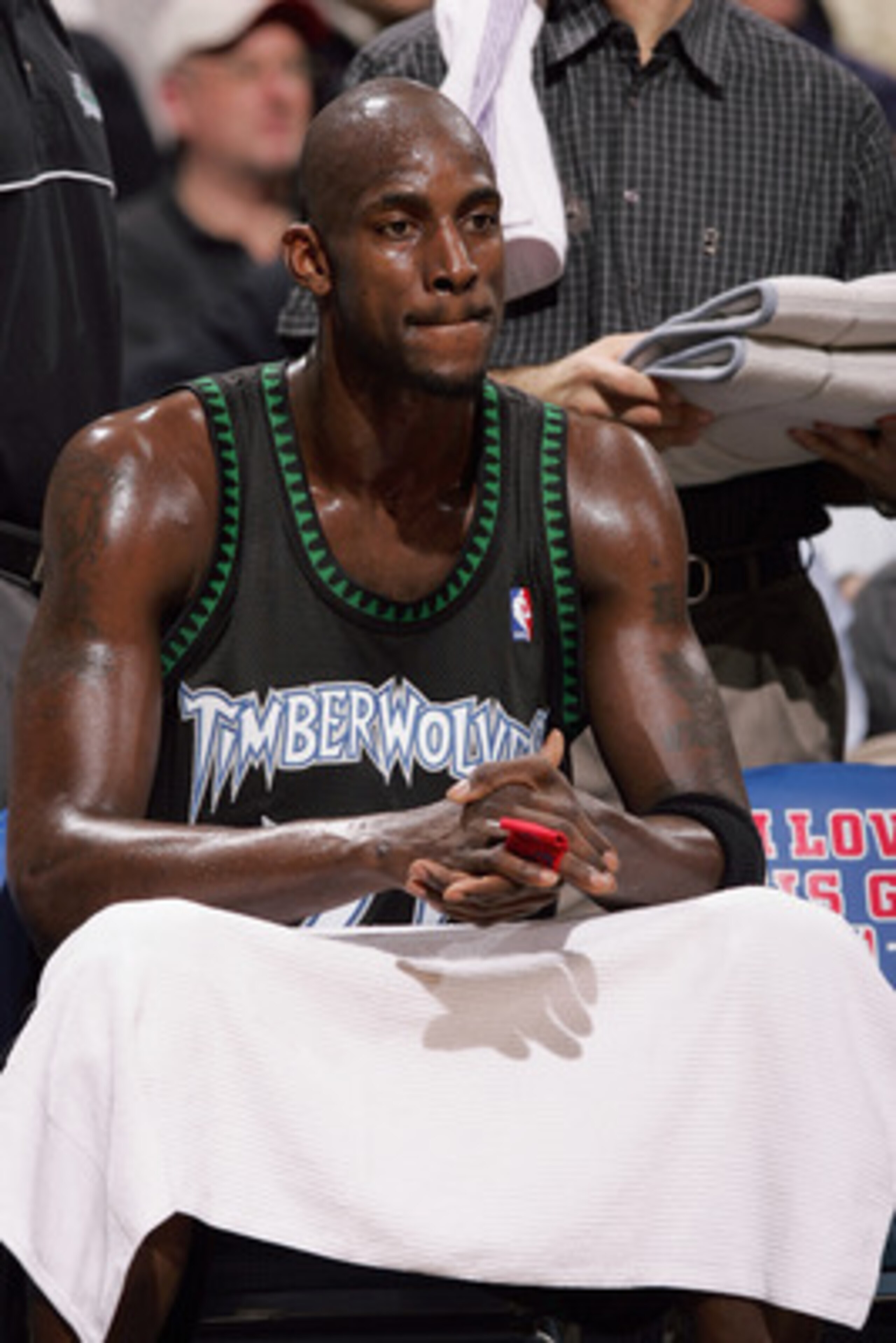 MILWAUKEE - FEBRUARY 1:  Kevin Garnett #21 of the Minnesota Timberwolves looks on as he sits on the bench against the Milwaukee Bucks on February 1, 2005 at Bradley Center in Milwaukee, Wisconsin. The Bucks defeated the Wolves 91-86.  NOTE TO USER: User e