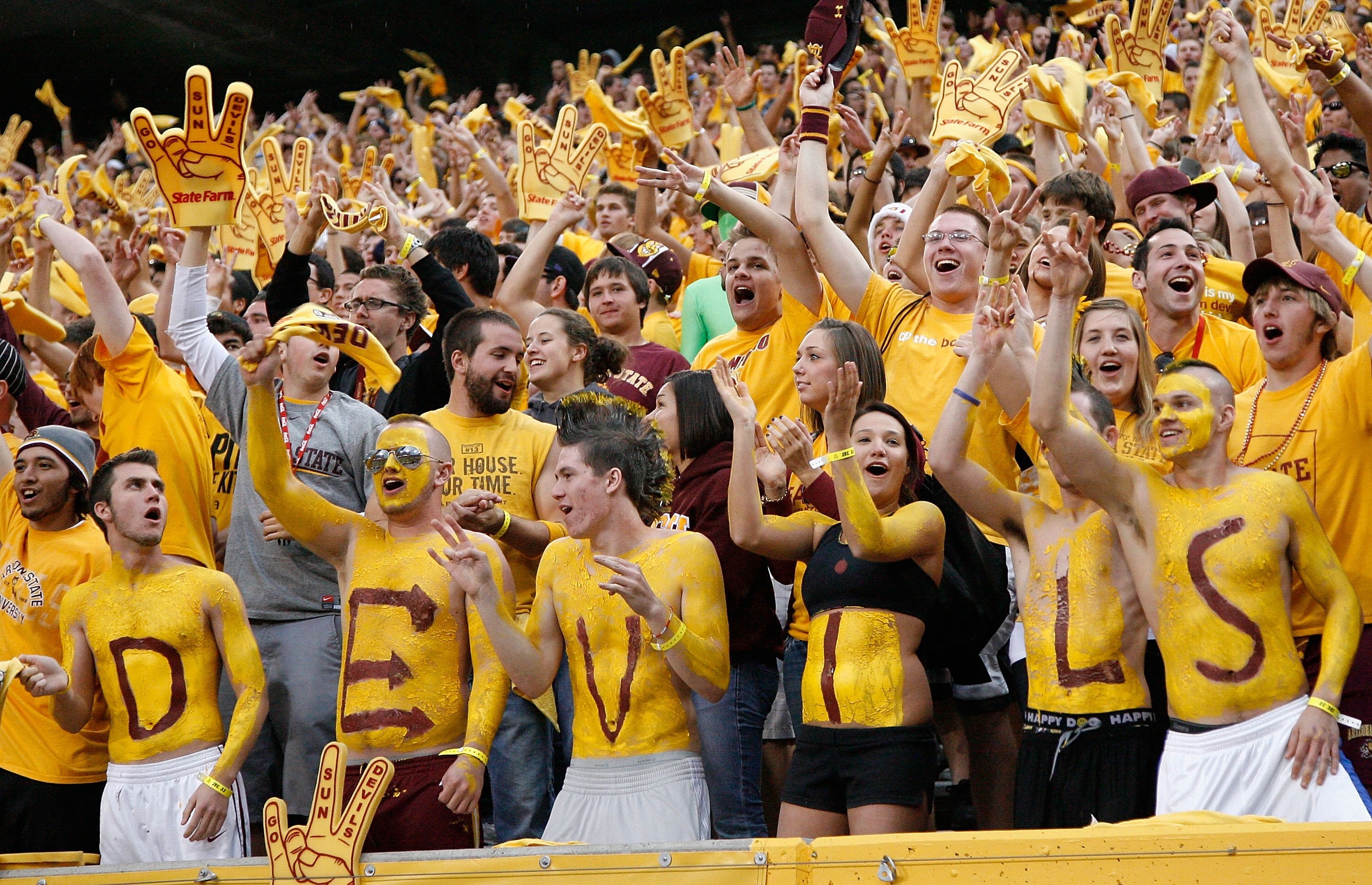 TEMPE, AZ - NOVEMBER 28:  Fans of the Arizona State Sun Devils cheer during the college football game against the Arizona Wildcats at Sun Devil Stadium on November 28, 2009 in Tempe, Arizona.  The Wildcats defeated the Sun Devils 20-17.  (Photo by Christi