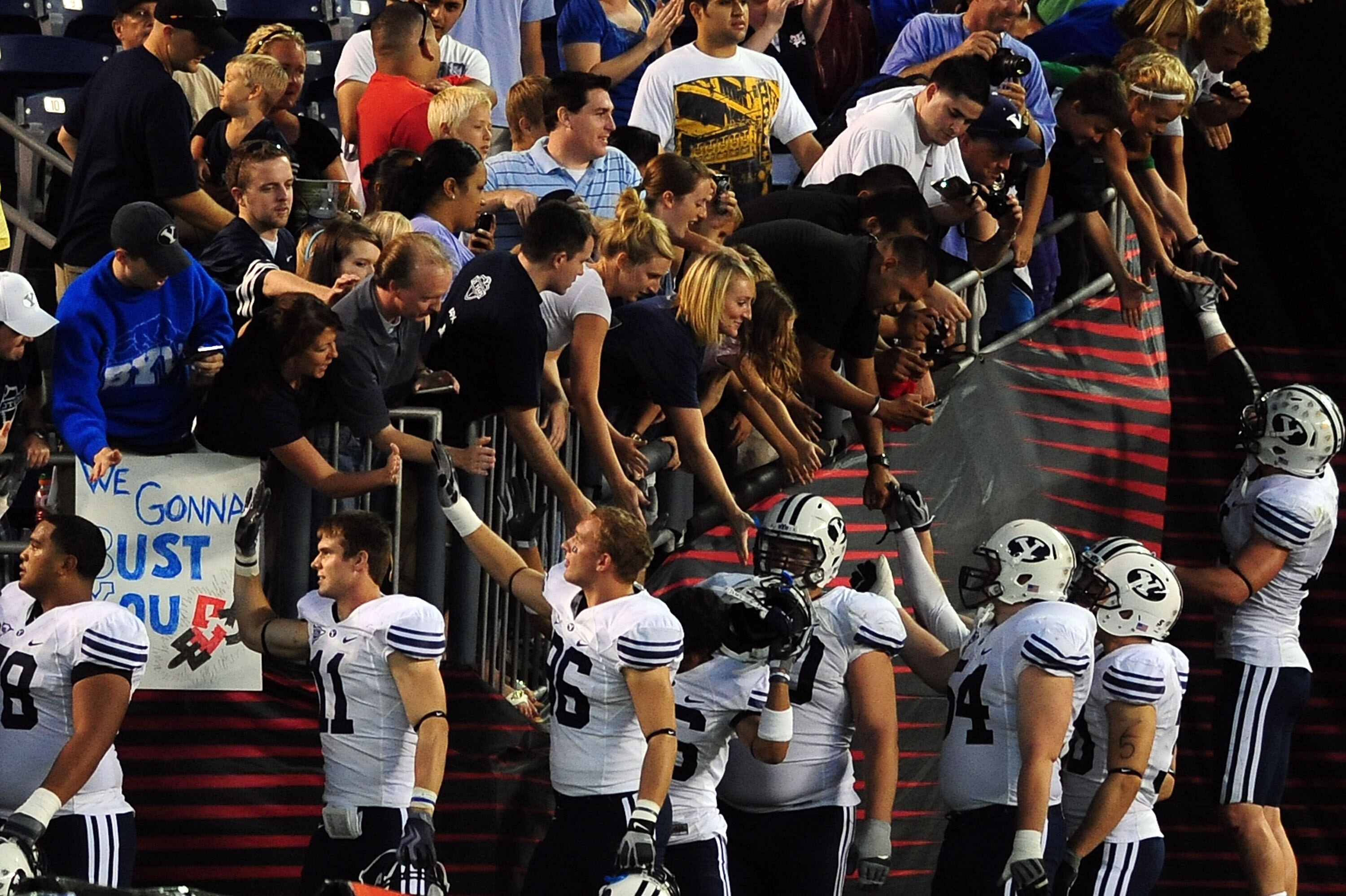 SAN DIEGO - OCTOBER 17: BYU Cougars celebrates with fans after the game against San Diego State Aztecs at Qualcomm Stadium on October 17, 2009 in San Diego, California.  (Photo by Jacob de Golish/Getty Images)
