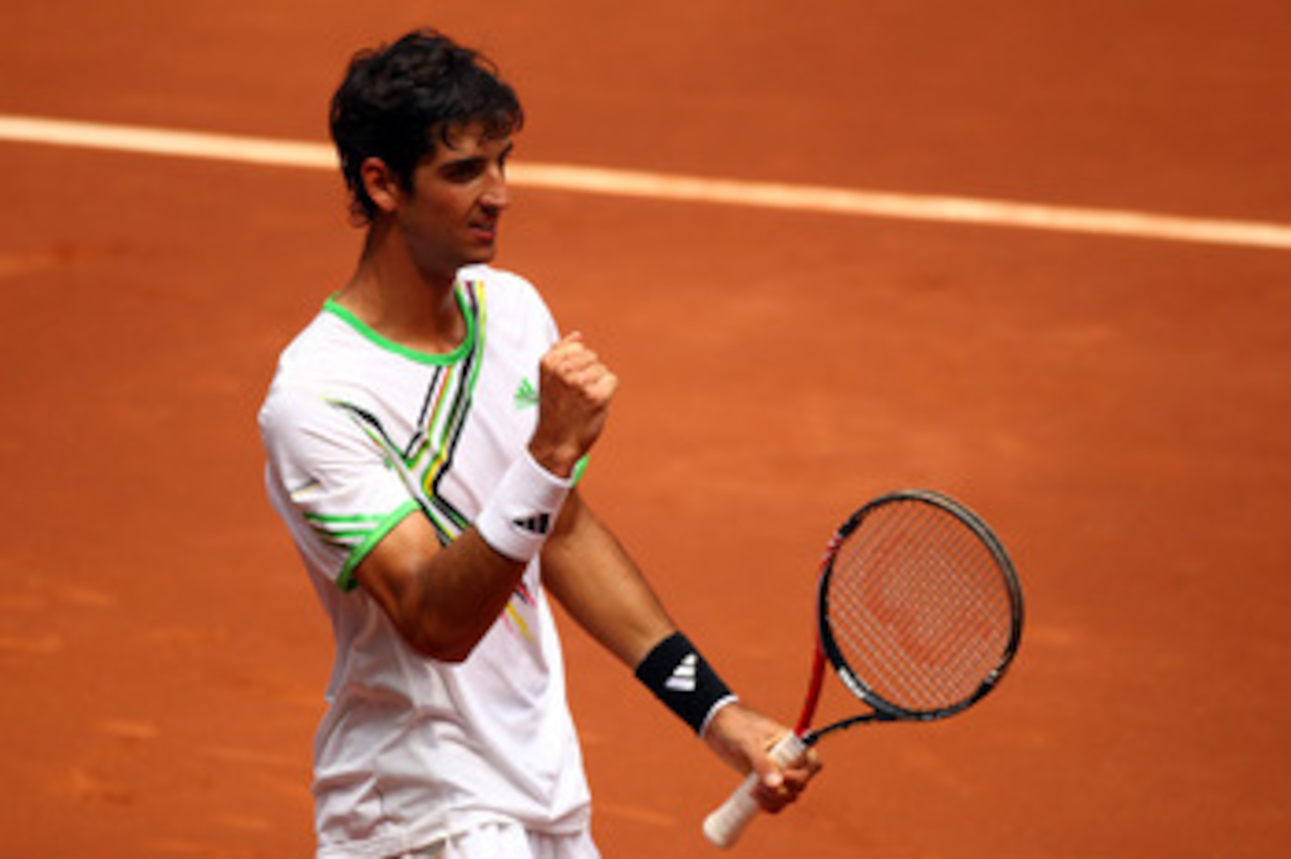 MADRID, SPAIN - MAY 06:  Thomaz Bellucci of Brazil celebrates defeating Tomas Berdych of Czech Republic during day seven of the Mutua Madrilena Madrid Open Tennis on May 6, 2011 in Madrid, Spain.  (Photo by Julian Finney/Getty Images)