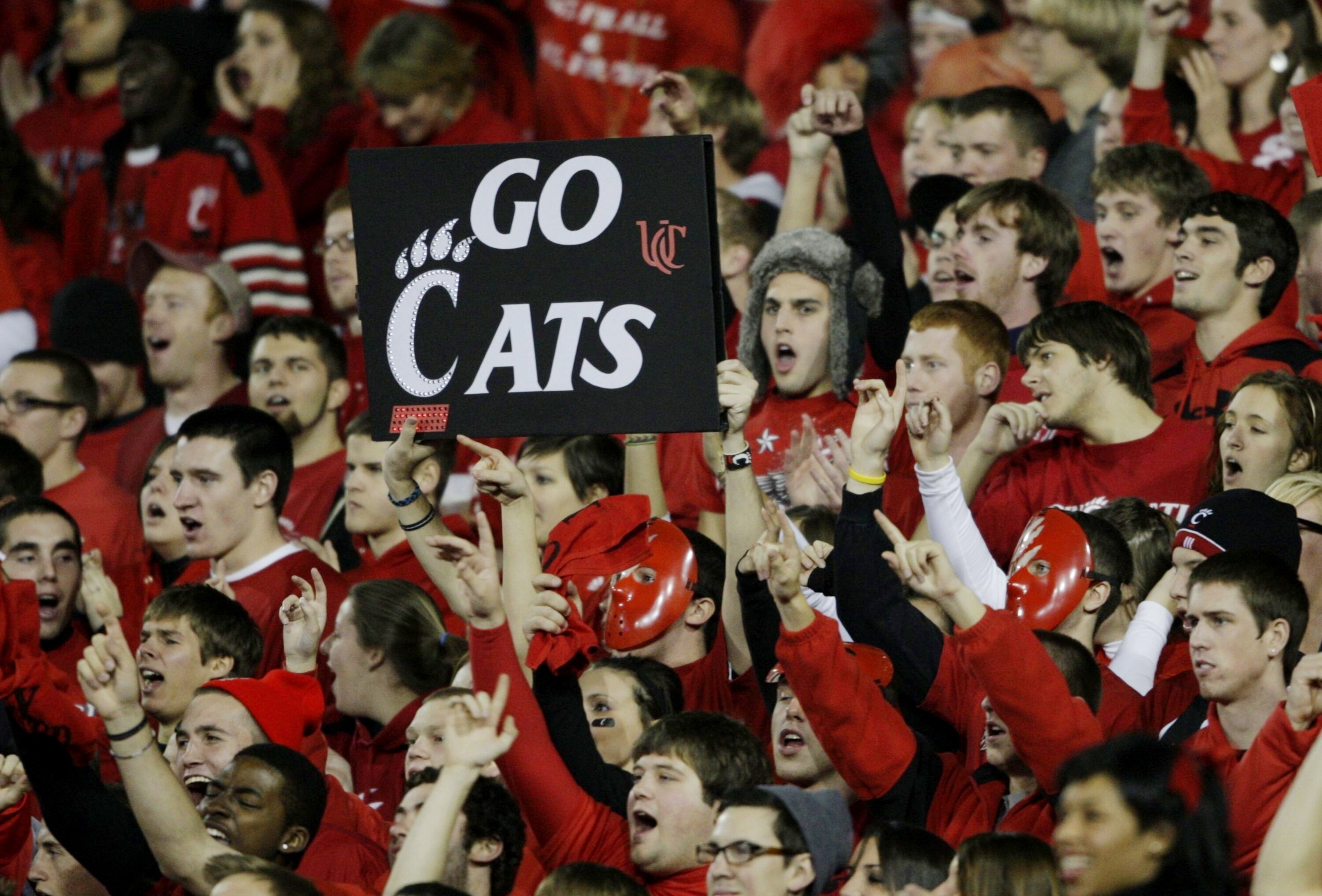 CINCINNATI - NOVEMBER 13:  Fans of the Cincinnati Bearcats cheer on their team at the start of the game against the West Virginia Mountaineers at Nippert Stadium on November 13, 2009 in Cincinnati, Ohio.  (Photo by Andy Lyons/Getty Images)