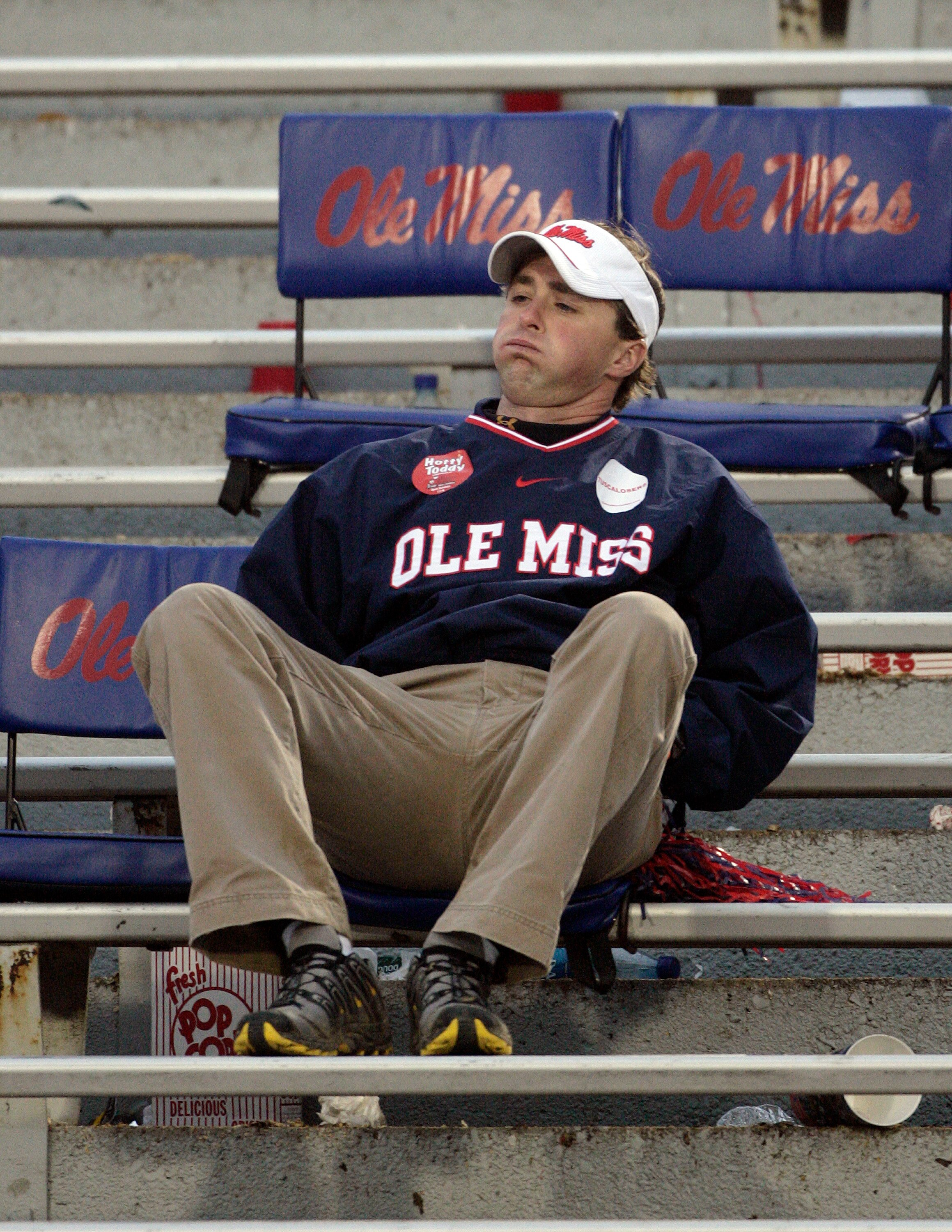 OXFORD, MS - OCTOBER 10: A Mississippi Rebel fans sits dejectedly in the stands following a 22-3 loss to the Alabama Crimson Tide in  their college football game at Vaught-Hemingway Stadium on October 10, 2009 in Oxford, Mississippi. (Photo by Dave Martin