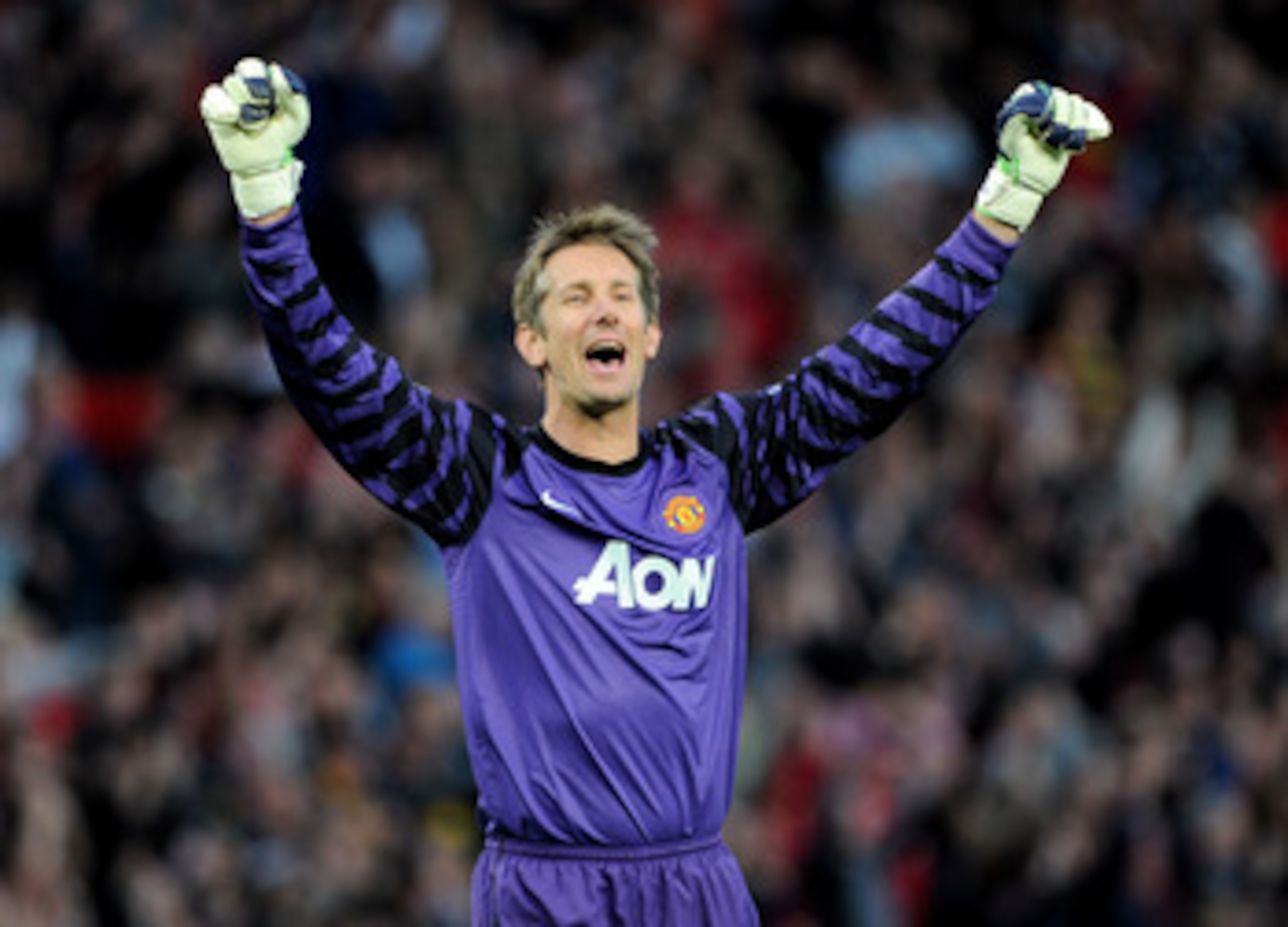 MANCHESTER, ENGLAND - MAY 04:  Edwin van der Sar of Manchester United celebrates after his team's second goal during the UEFA Champions League Semi Final second leg match between Manchester United and Schalke at Old Trafford on May 4, 2011 in Manchester,