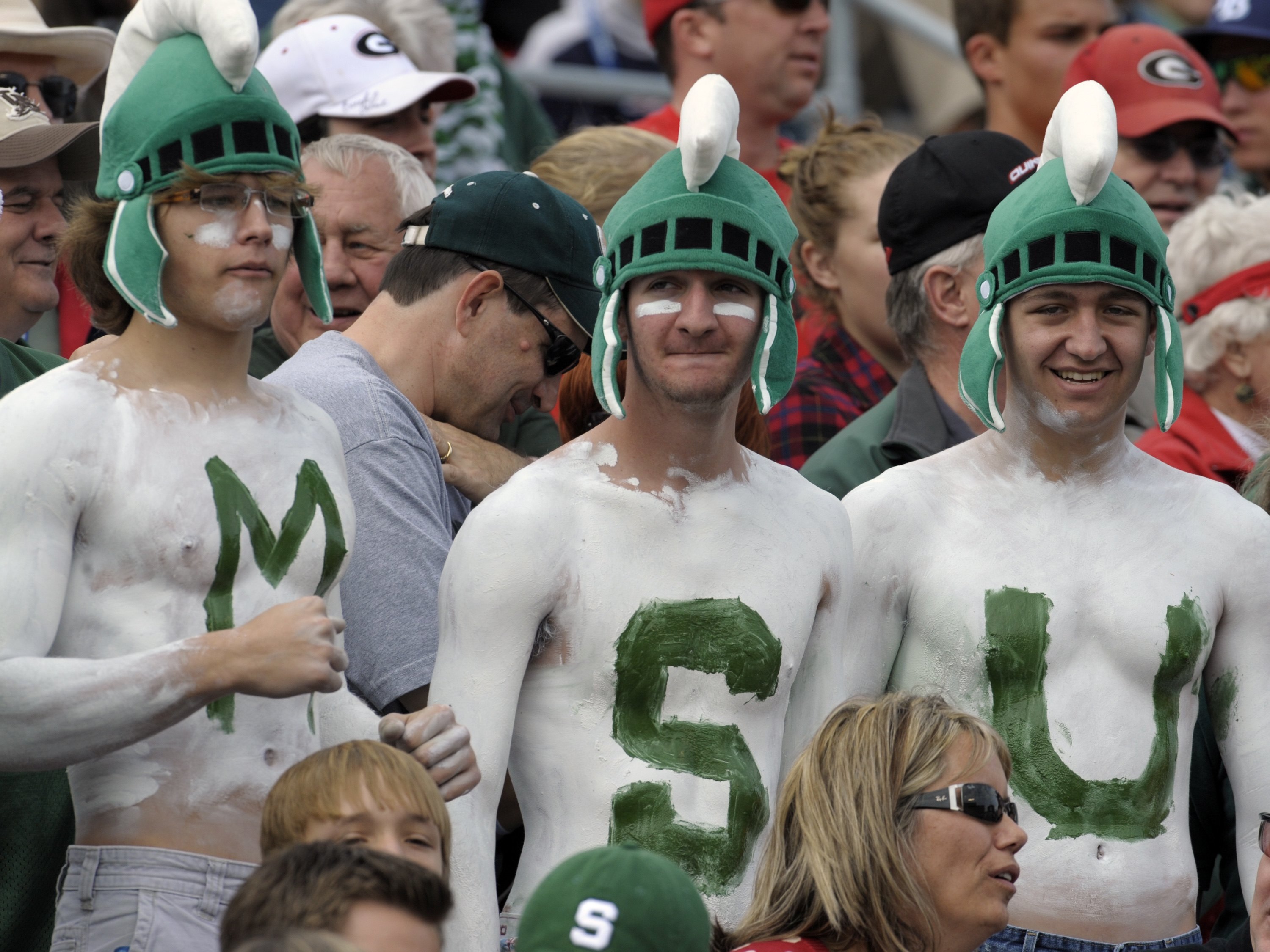 ORLANDO, FL - JANUARY 1: Fans of the Michigan State Spartans cheer play against the Georgia Bulldogs at the 2009 Capital One Bowl at the Citrus Bowl on January 1, 2009 in Orlando, Florida.  (Photo by Al Messerschmidt/Getty Images)