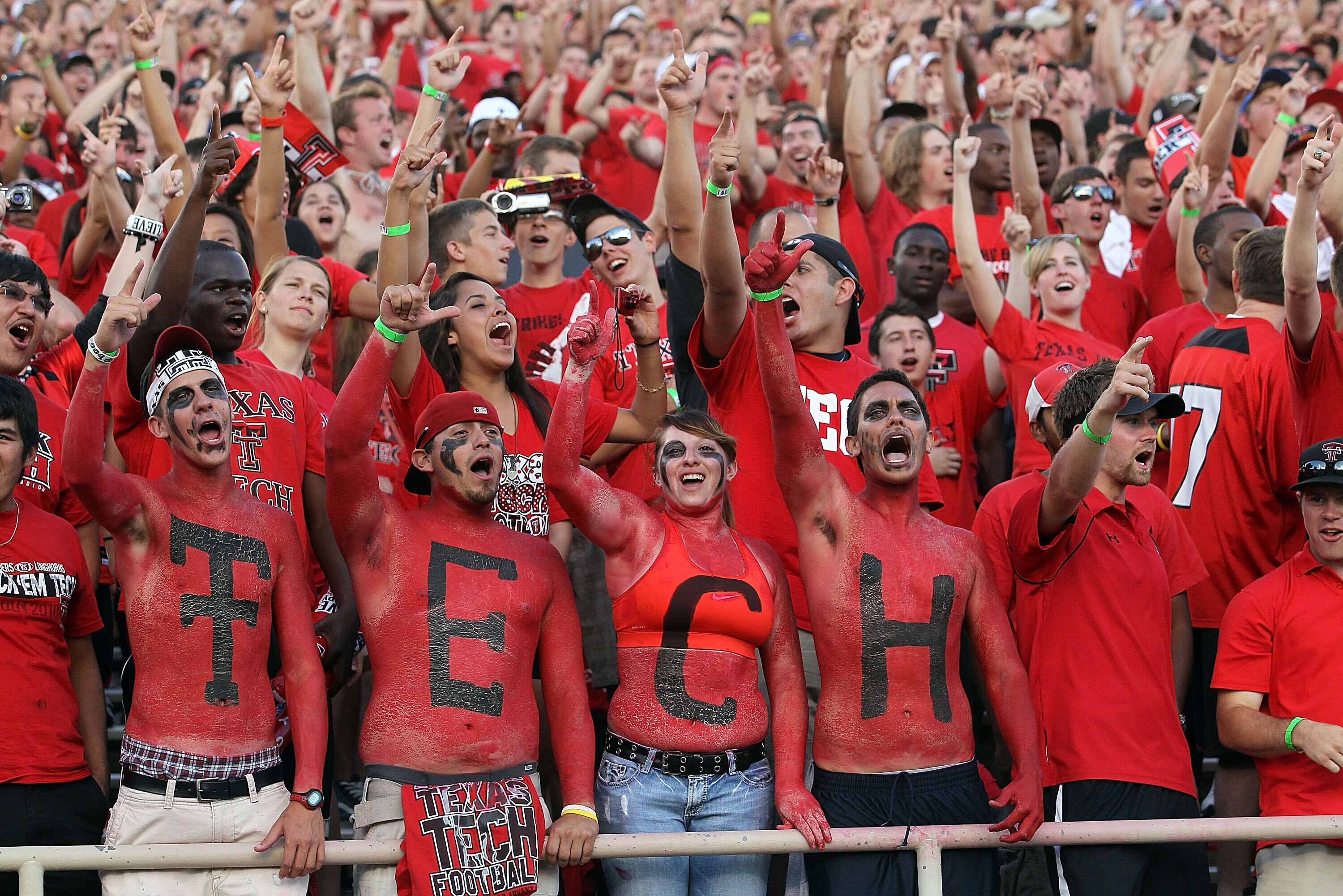 LUBBOCK, TX - SEPTEMBER 18:  Fans of the Texas Tech Red Raiders cheer against the Texas Longhorns at Jones AT&T Stadium on September 18, 2010 in Lubbock, Texas.  (Photo by Ronald Martinez/Getty Images)