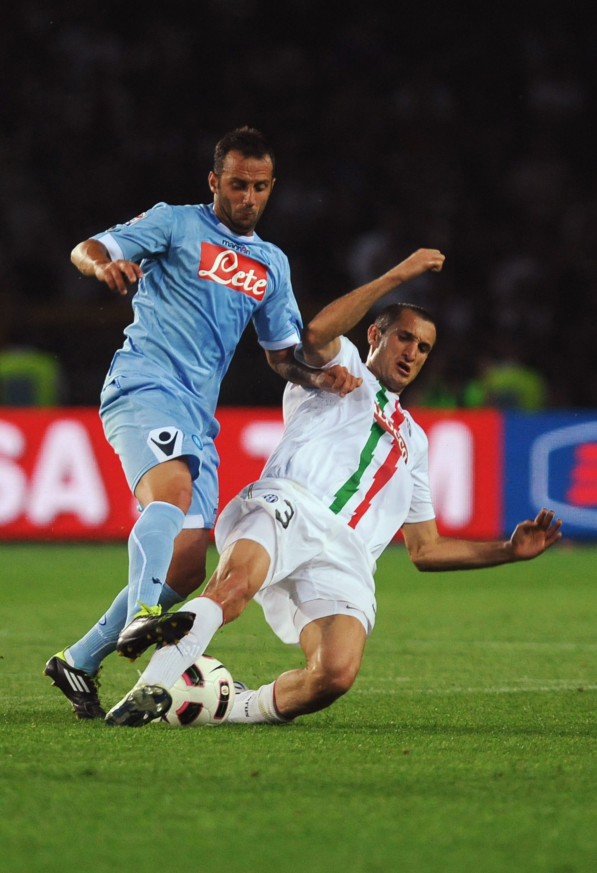 TURIN, ITALY - MAY 22:  Giorgio Chiellini of Juventus FC competes with Giuseppe Mascara of SSC Napoli during the Serie A match between Juventus FC and SSC Napoli at Olimpico Stadium on May 22, 2011 in Turin, Italy.  (Photo by Valerio Pennicino/Getty Image