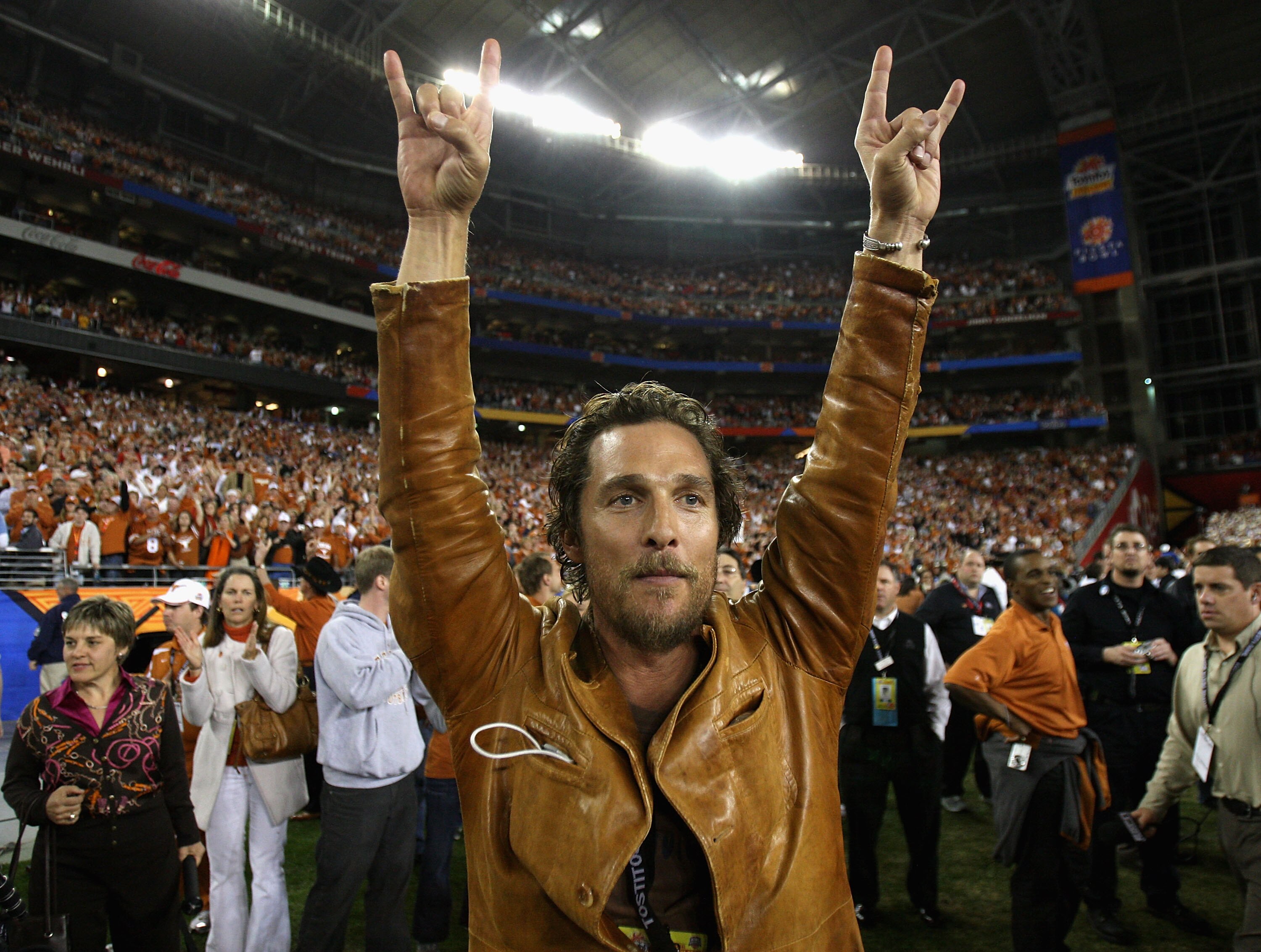 GLENDALE, AZ - JANUARY 05:  Actor Matthew McConaughey celebrates after the Texas Longhorns defeated the Ohio State Buckeyes in Tostitos Fiesta Bowl Game on January 5, 2009 at University of Phoenix Stadium in Glendale, Arizona.  (Photo by Jed Jacobsohn/Get