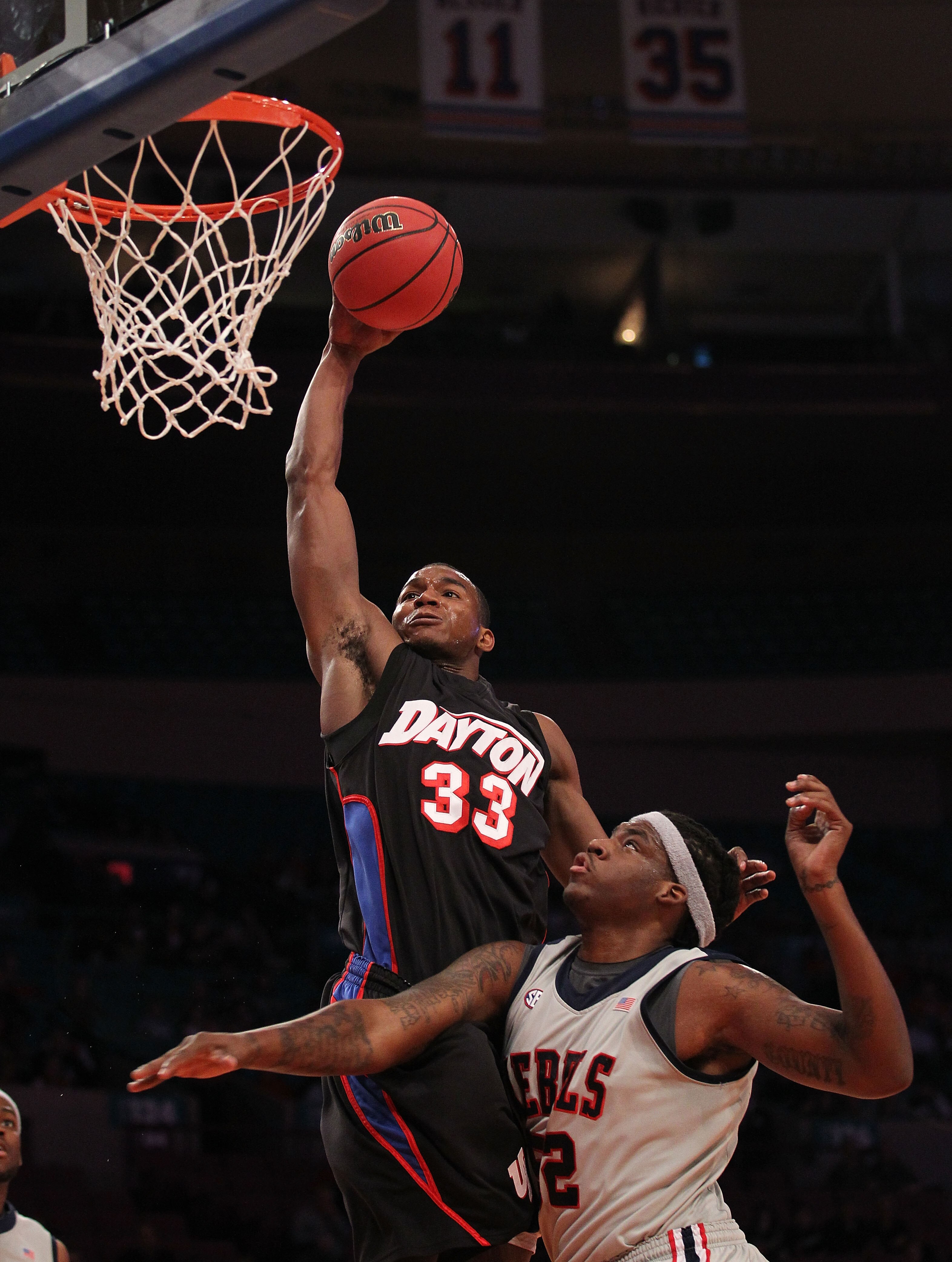 NEW YORK - MARCH 30: Chris Wright #33 of the Dayton Flyers goes over DeAundre Cranston #52 of Ole Miss during their semi final at Madison Square Garden on March 30, 2010 in New York, New York.  (Photo by Nick Laham/Getty Images)