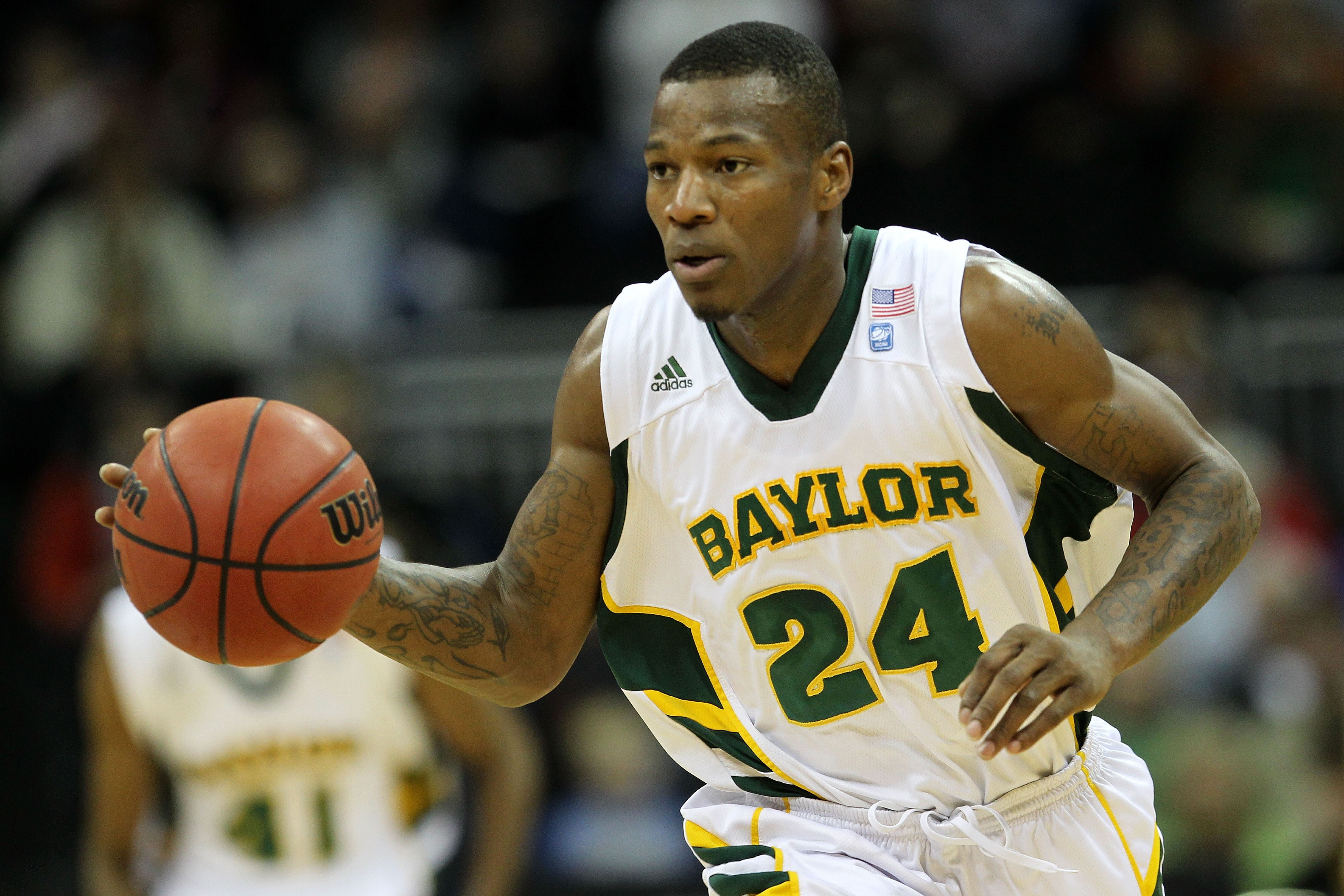 KANSAS CITY, MO - MARCH 09:  LaceDarius Dunn #24 of the Baylor Bears controls the ball against the Oklahoma Sooners during their game in the first round of the 2011 Phillips 66 Big 12 Men's Basketball Tournament at Sprint Center on March 9, 2011 in Kansas