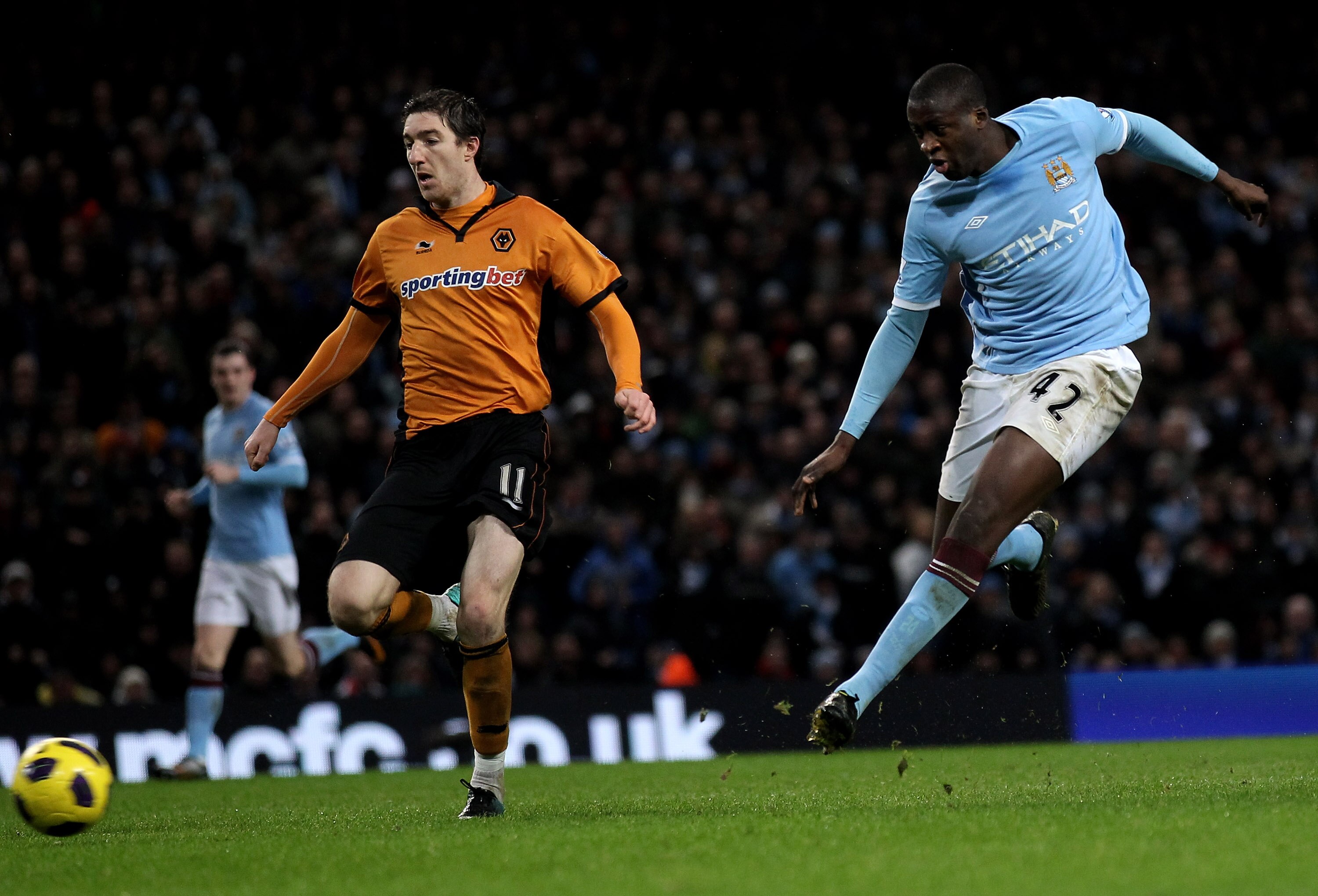 MANCHESTER, ENGLAND - JANUARY 15:  Yaya Toure of Manchester City scores his team's third goal during the Barclays Premier League match between Manchester City and Wolverhampton Wanderers at the City of Manchester Stadium on January 15, 2011 in Manchester,