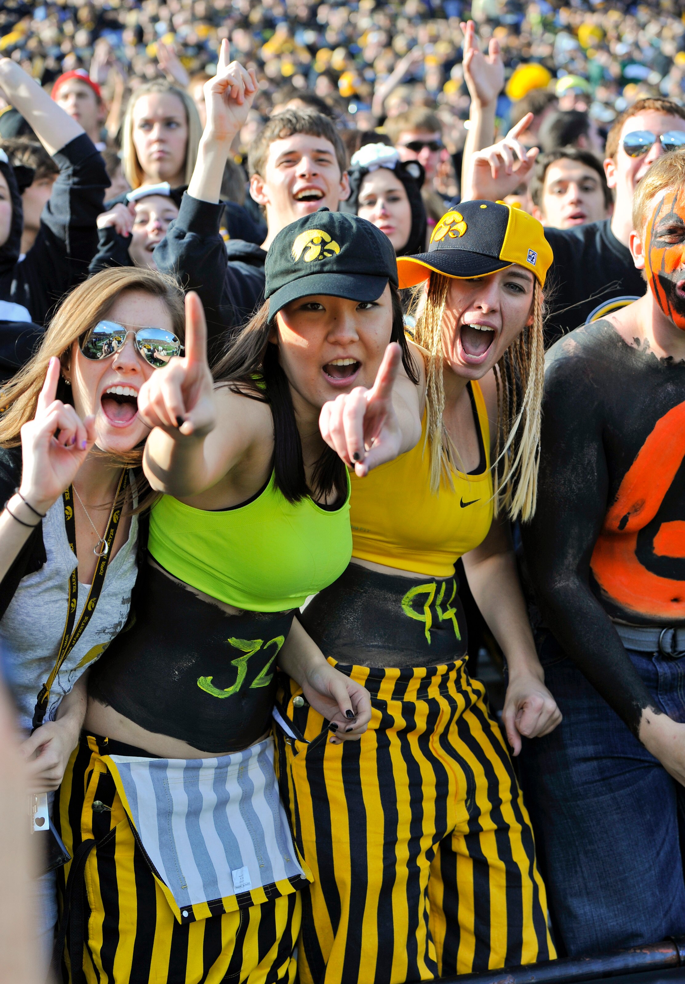 IOWA CITY, IA - OCTOBER 30- University of Iowa Hawkeyes fans cheer on their team during play against the Michigan State Spartans at Kinnick Stadium on October 30, 2010 in Iowa City, Iowa. Iowa won 37-6 over Michigan State. (Photo by David Purdy/Getty Imag