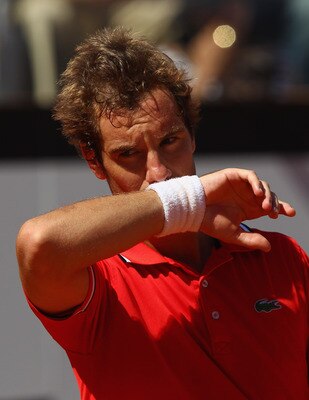ROME, ITALY - MAY 14:  Richard Gasquet of France  shows his dejection during his semi final match against  Rafael Nadal of Spain during day seven of the Internazoinali BNL D'Italia at the Foro Italico Tennis Centre  on May 14, 2011 in Rome, Italy.  (Photo