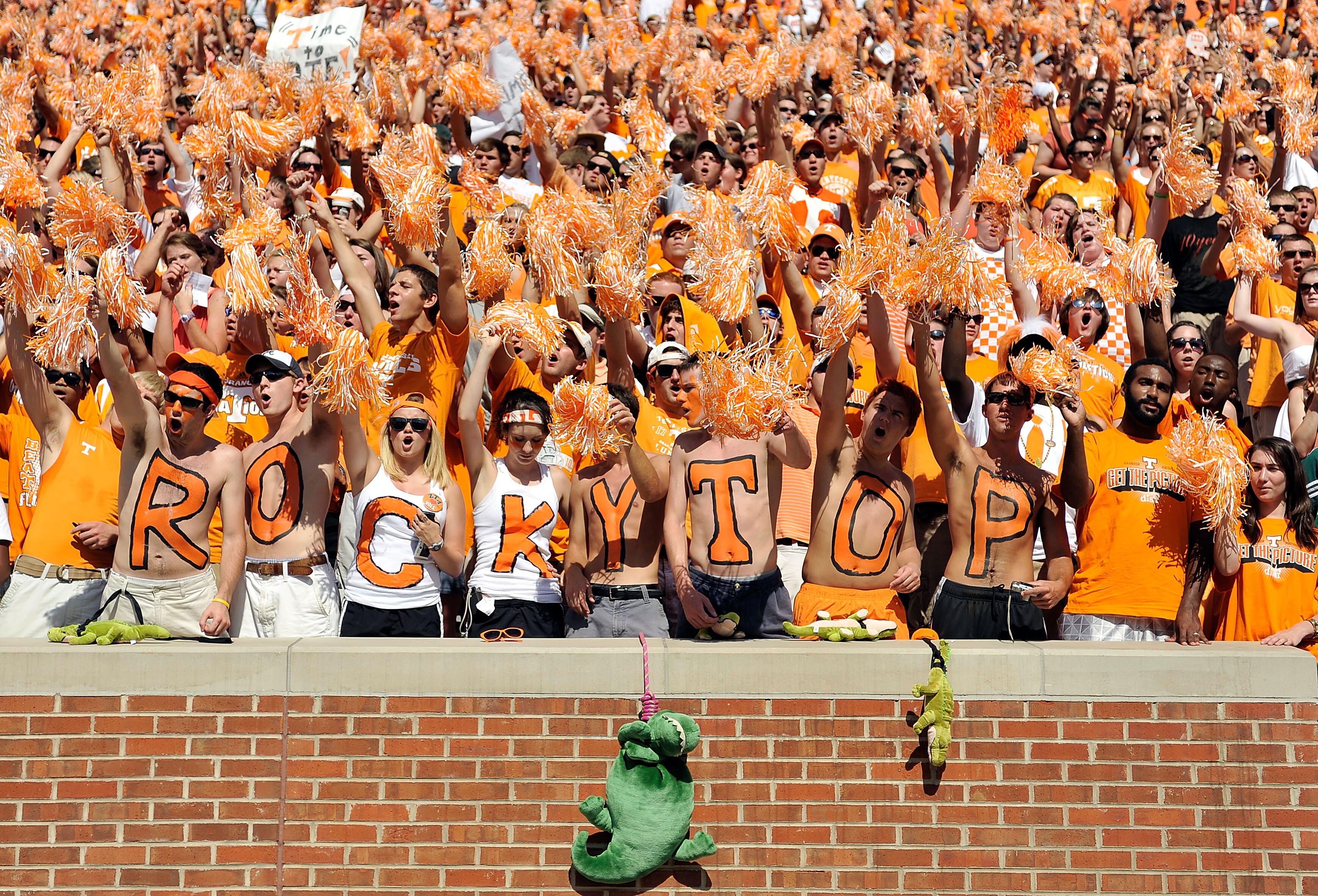 KNOXVILLE, TN - SEPTEMBER 18:  Orange-clad Tennessee Volunteers fans sing along with 'Rocky Top' during a game against the Florida Gators at Neyland Stadium on September 18, 2010 in Knoxville, Tennessee. Florida won 31-17.  (Photo by Grant Halverson/Getty