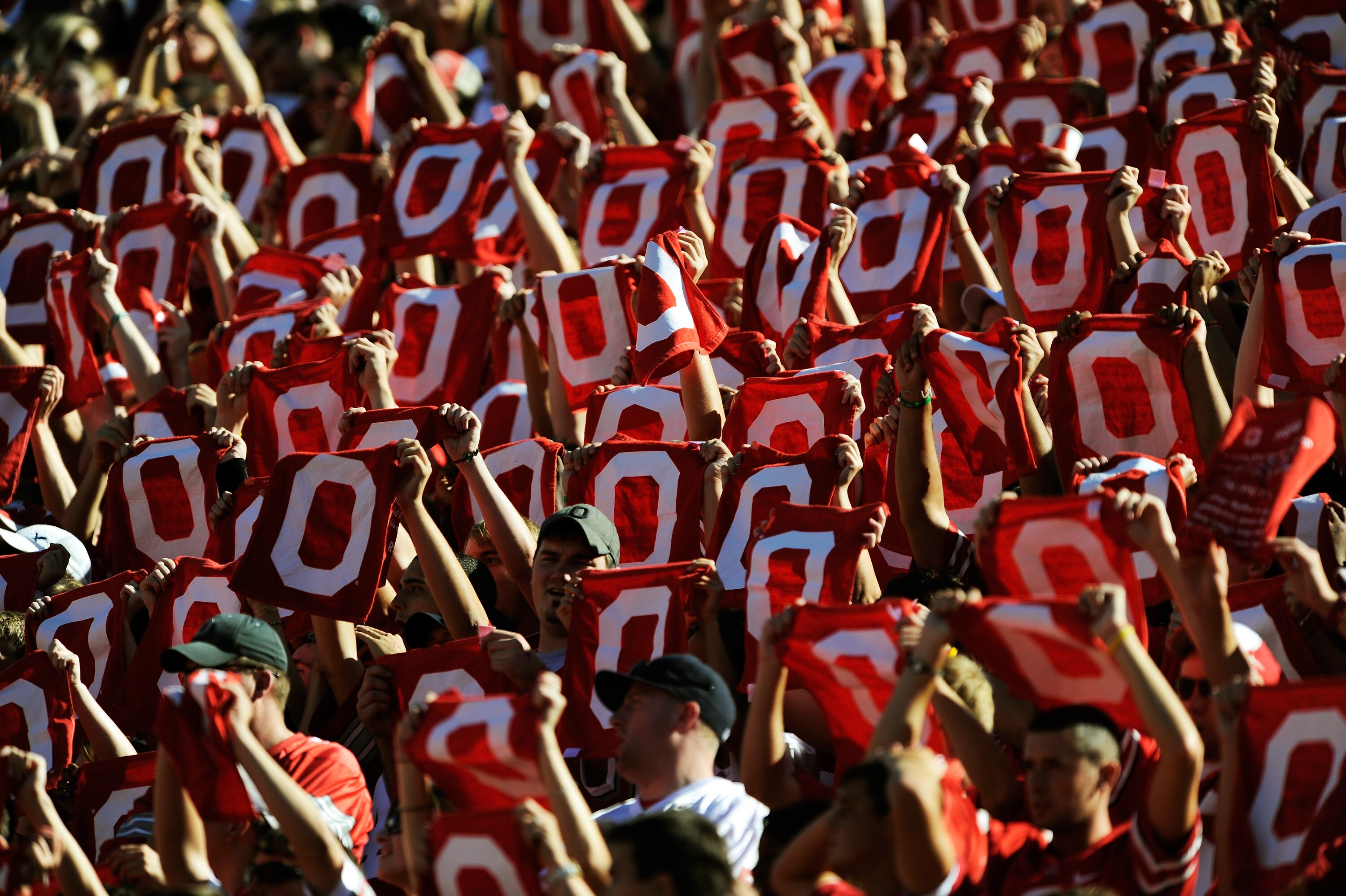 COLUMBUS, OH - SEPTEMBER 25:  Ohio State Buckeyes fans wave towels with the block letter 'O' during a game against the Eastern Michigan Eagles at Ohio Stadium on September 25, 2010 in Columbus, Ohio.  (Photo by Jamie Sabau/Getty Images)