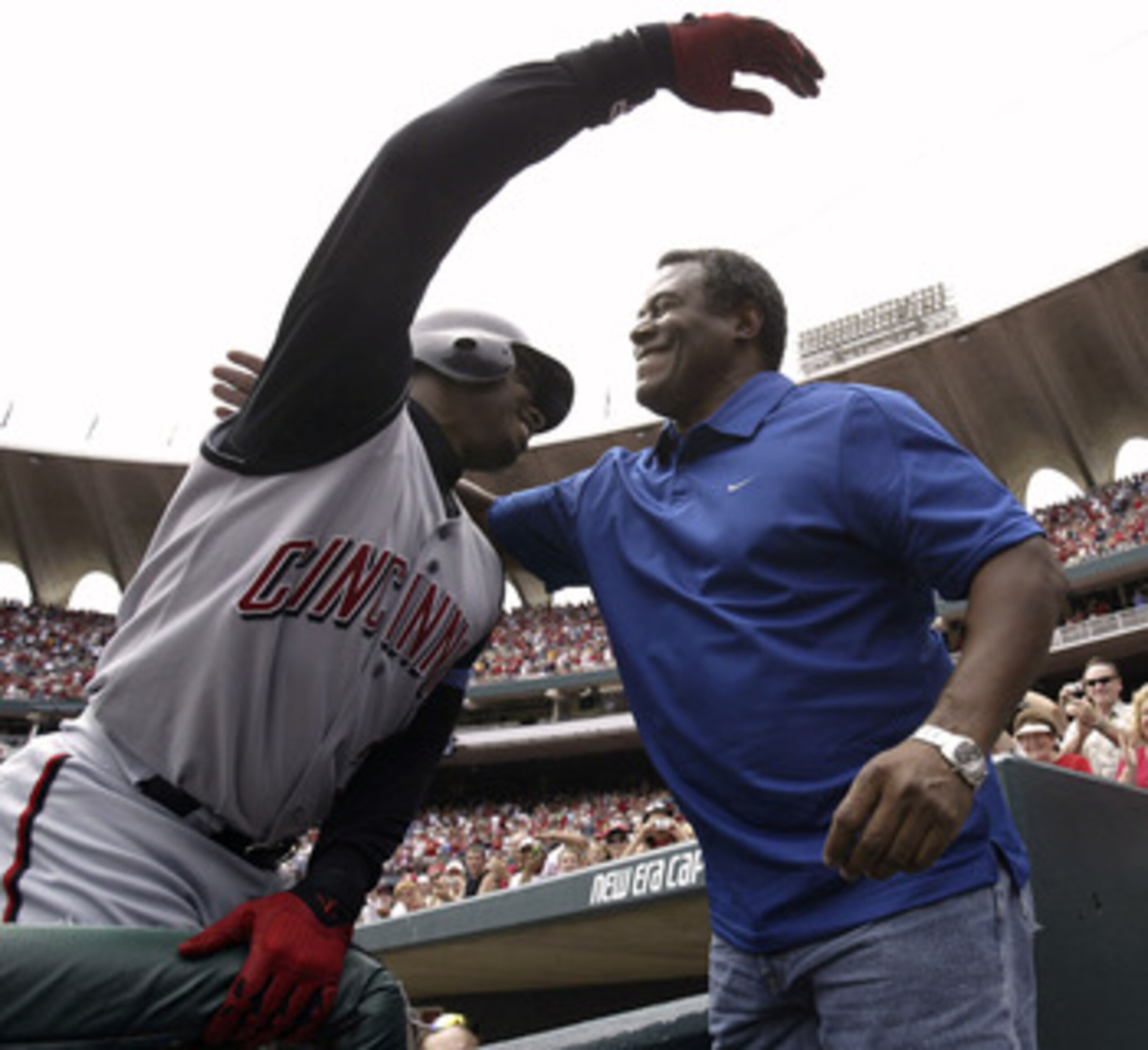 ST. LOUIS - JUNE 20:  Ken Griffey Jr. (L) #30 of the Cincinnati Reds is congratulated by his father Ken Griffey Sr. after junior hit his 500th career home run in the sixth inning against Matt Morris of the St. Louis Cardinals on June 20, 2004 at Busch Sta