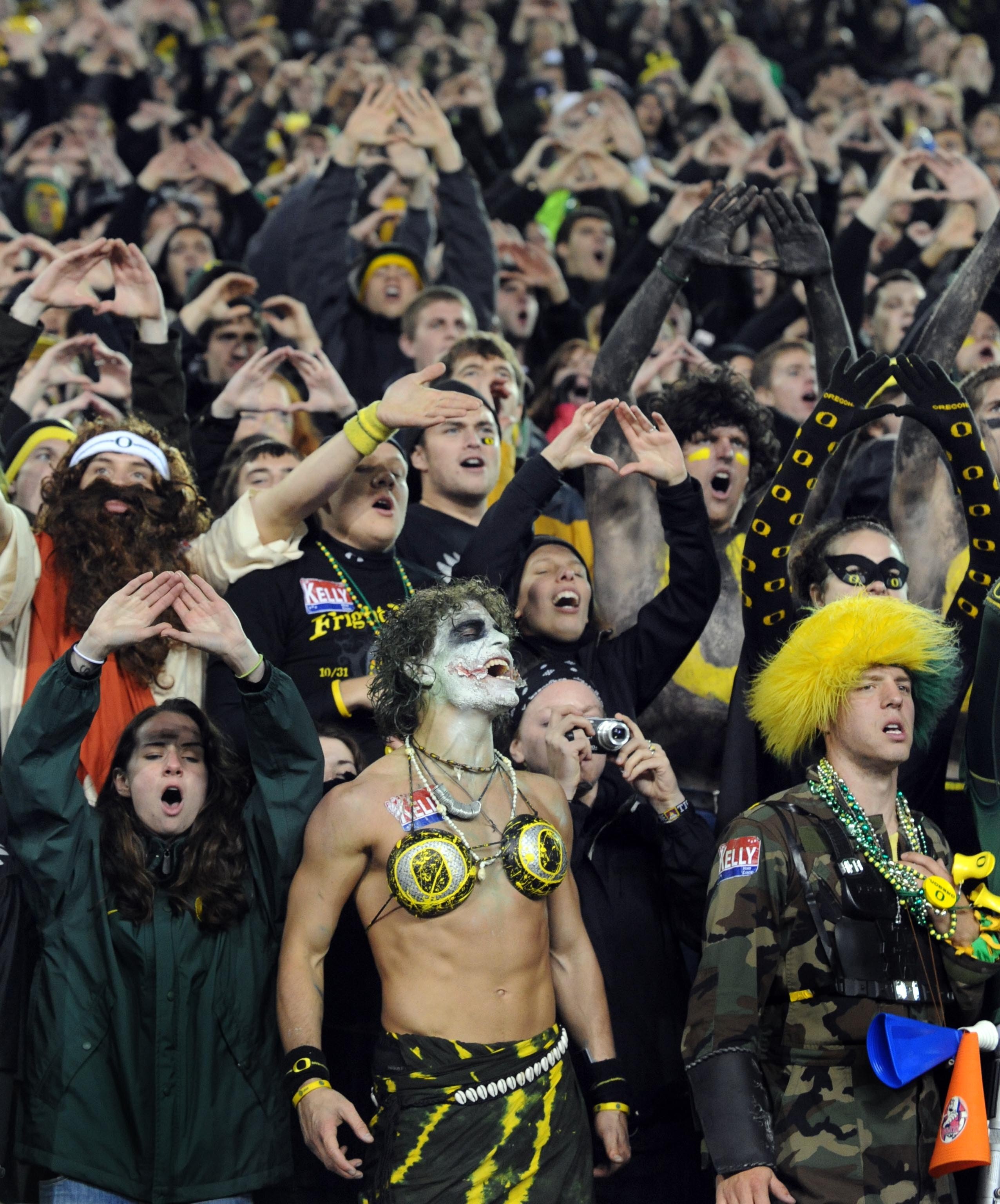 EUGENE, OR - OCTOBER 31: Oregon Ducks fans make some noise on a Halloween night game against the USC Trojans at Autzen Stadium on October 31, 2009 in Eugene, Oregon. The crowd noise at Autzen Stadium is said to be one of the loudest in the nation and repo