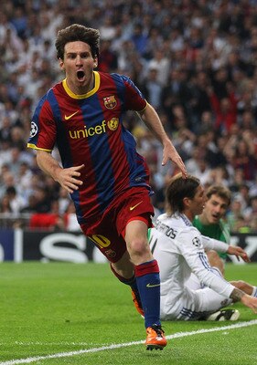 MADRID, SPAIN - APRIL 27: Lionel Messi of Barcelona celebrates after scoring his first goal during the UEFA Champions League Semi Final first leg match between Real Madrid and Barcelona at Estadio Santiago Bernabeu on April 27, 2011 in Madrid, Spain. (Pho