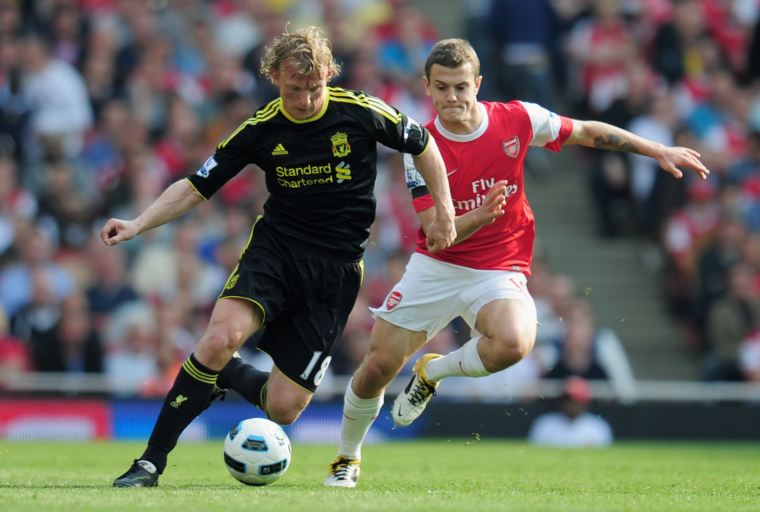 LONDON, ENGLAND - APRIL 17:  Dirk Kuyt of Liverpool is closed down by Jack Wilshere of Arsenal during the Barclays Premier League match between Arsenal and Liverpool at the Emirates Stadium on April 17, 2011 in London, England.  (Photo by Shaun Botterill/