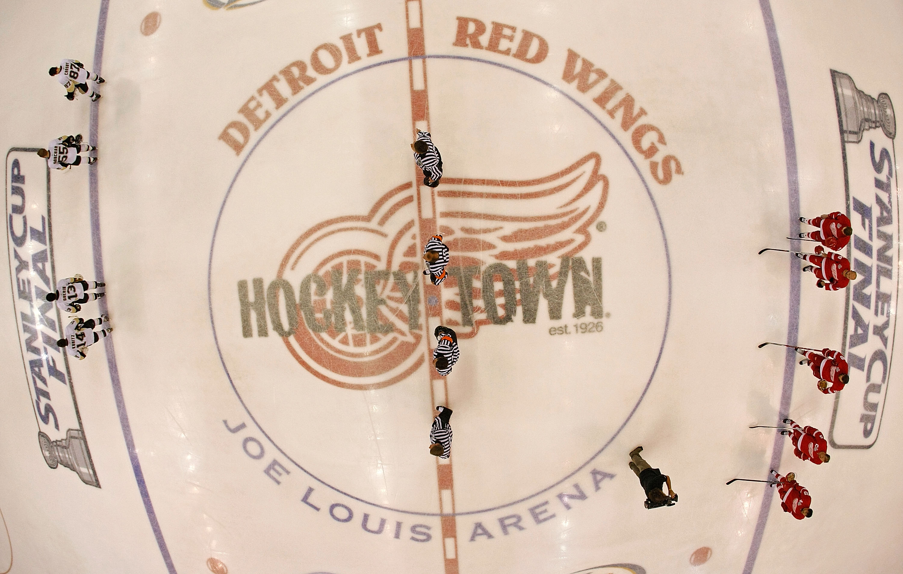 DETROIT - JUNE 12: The Pittsburgh Penguins and the Detroit Red Wings stand during the National Anthem before facing off in Game Seven of the 2009 NHL Stanley Cup Finals at Joe Louis Arena on June 12, 2009 in Detroit, Michigan. (Photo by Harry How/Getty DETROIT - JUNE 12: The Pittsburgh Penguins and the Detroit Red Wings stand during the National Anthem before facing off in Game Seven of the 2009 NHL Stanley Cup Finals at Joe Louis Arena on June 12, 2009 in Detroit, Michigan. (Photo by Harry How/Getty