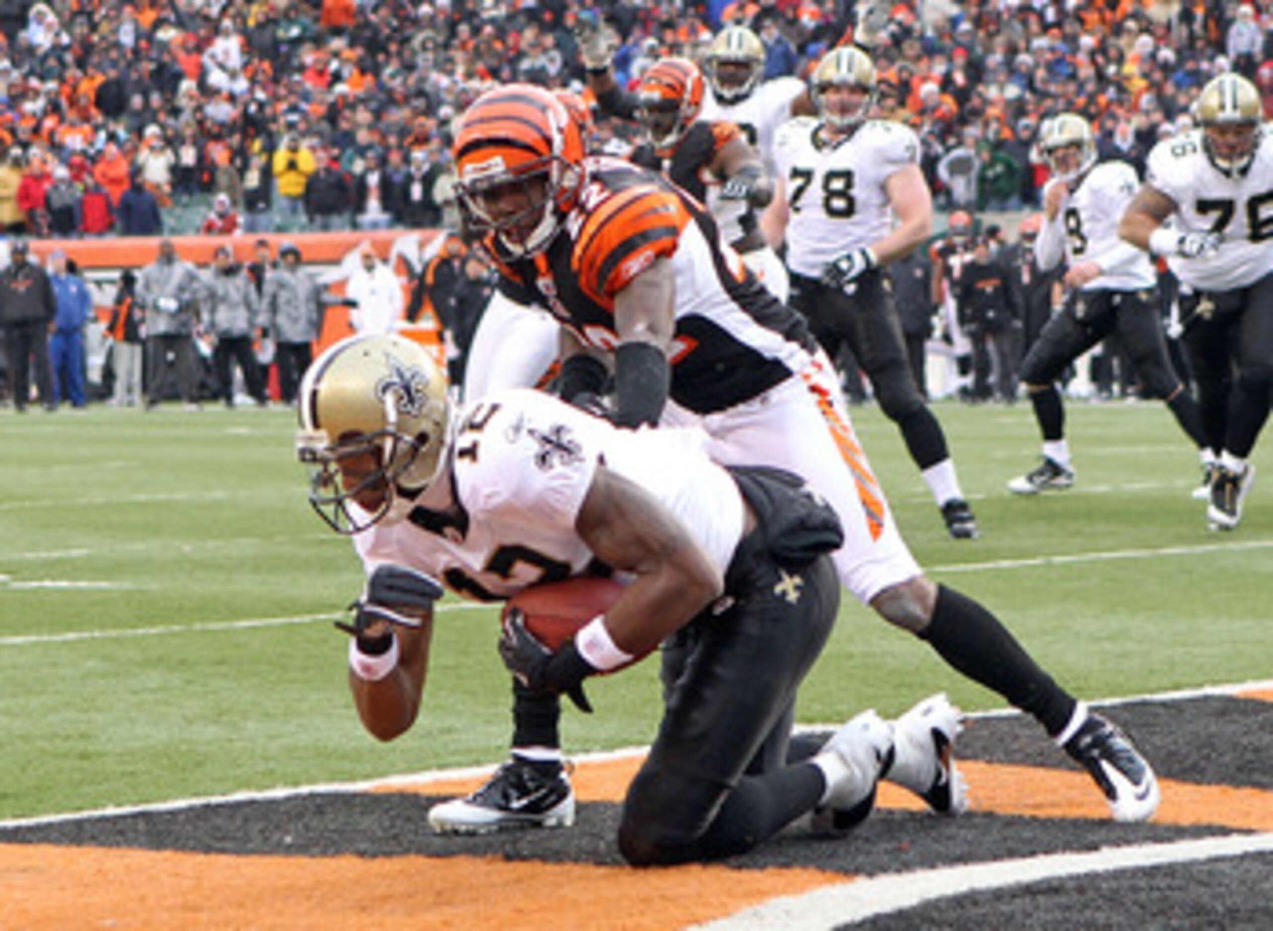 CINCINNATI, OH - DECEMBER 05: Marques Colston#12 of the New Orleans Saints catches the game winning touchdown in front of Johnathan Joseph #22 of the Cincinnati Bengals during the NFL game at Paul Brown Stadium on December 5, 2010 in Cincinnati, Ohio.  Th