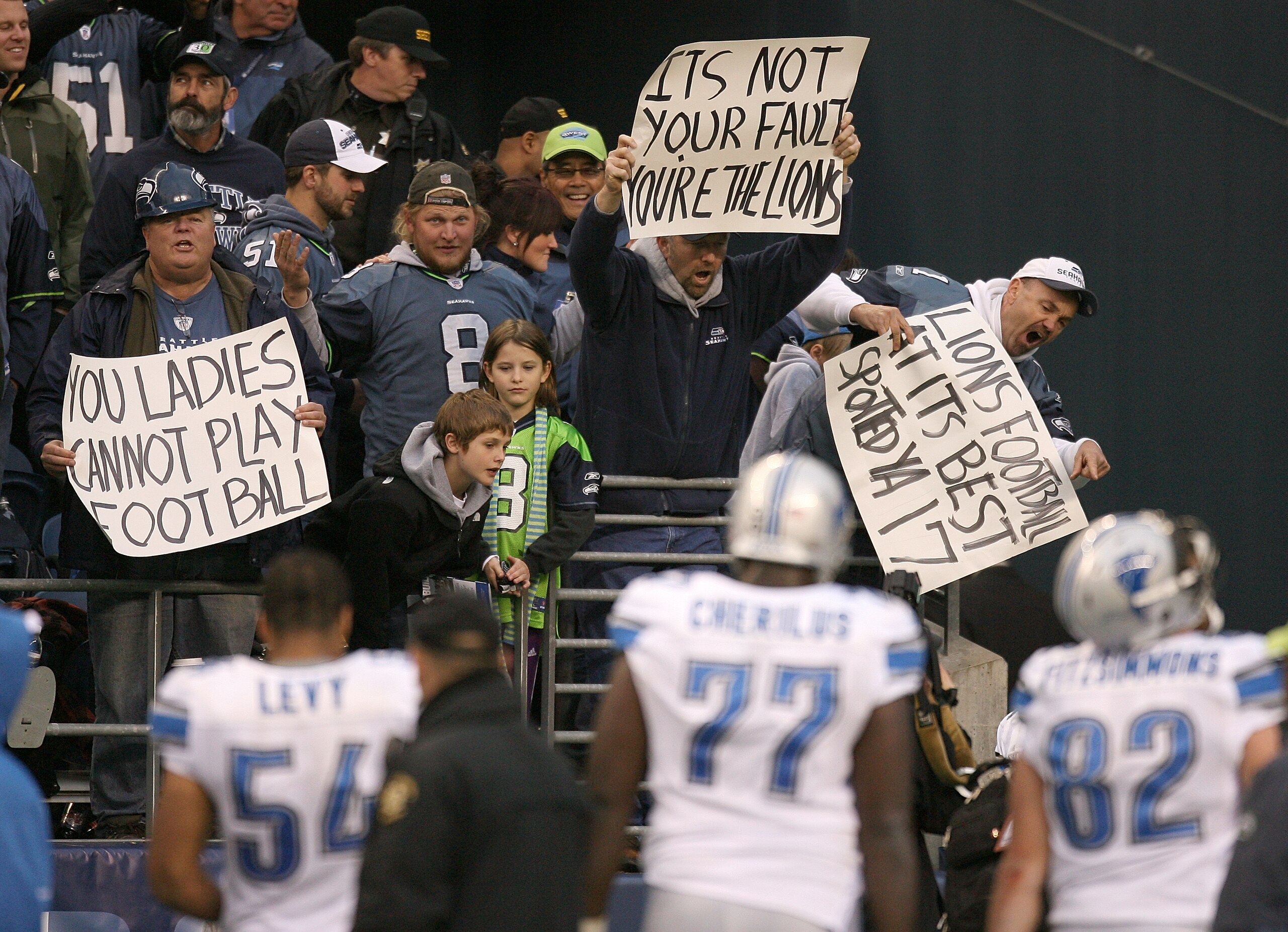 SEATTLE - NOVEMBER 08:  DeAndre Levy #54, Gosder Cherilus #77 and Casey FitzSimmons #82 of the Detroit Lions leave the field after losing to the Seattle Seahawks 32-20 on November 8, 2009 at Qwest Field in Seattle, Washington. (Photo by Otto Greule Jr/Get