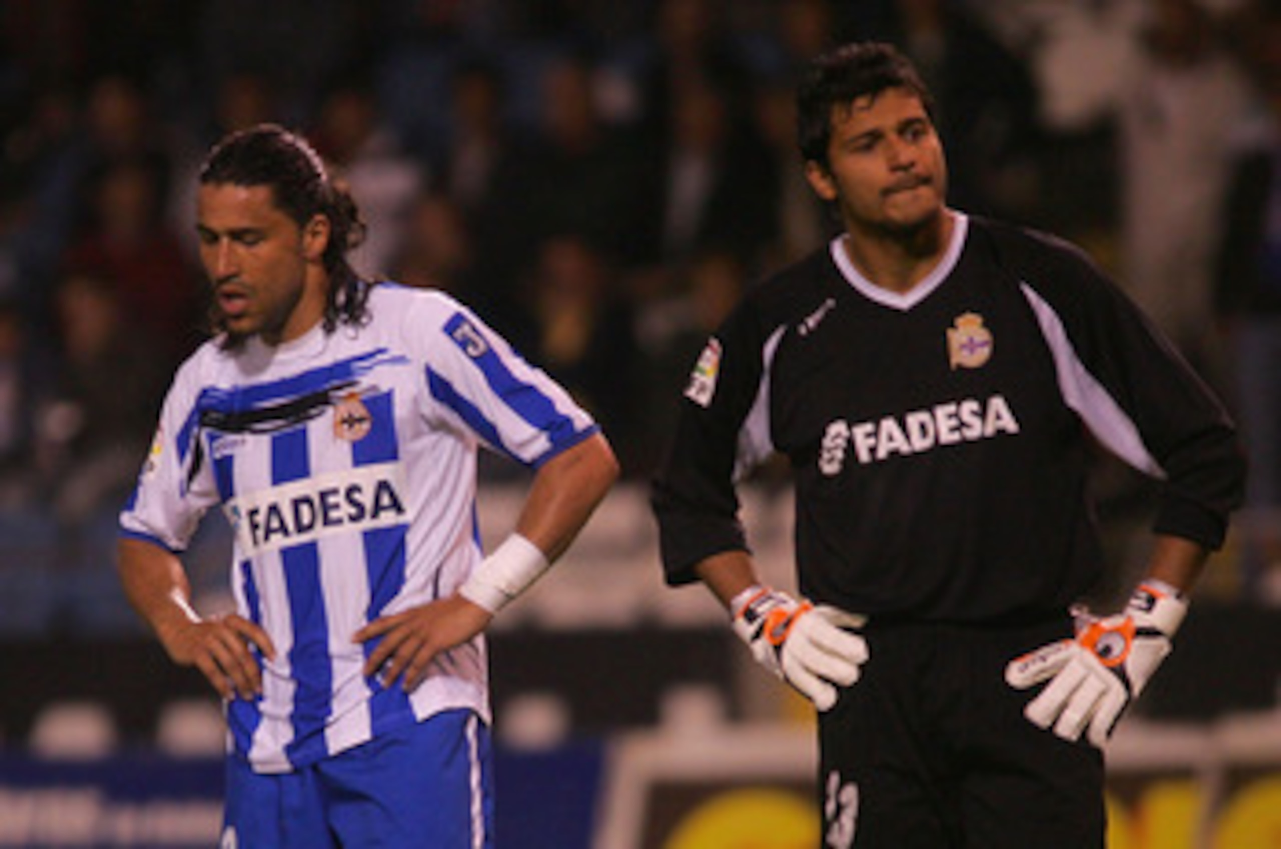 LA CORUNA, SPAIN - APRIL 19:  Juanma (L) and Gustavo Munia of Deportivo la Coruna look disappointed during the closing minutes of their Copa del Rey Semi Final, Second Leg match against Sevilla at the Riazor stadium on April 19, 2007 in La Coruna, Spain.