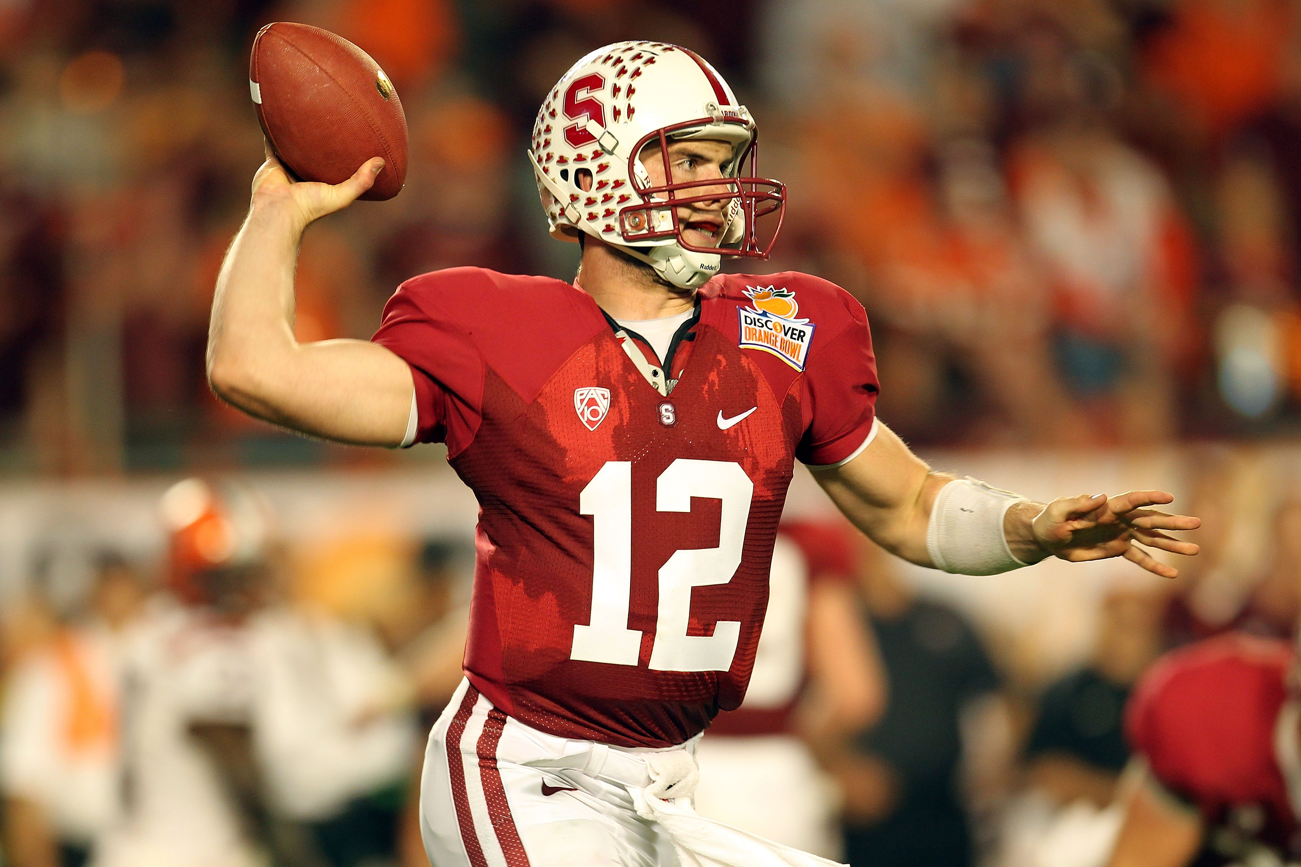 MIAMI, FL - JANUARY 03:  Andrew Luck #12 of the Stanford Cardinal throws pass against the Virginia Tech Hokies during the 2011 Discover Orange Bowl at Sun Life Stadium on January 3, 2011 in Miami, Florida. Stanford won 40-12. (Photo by Mike Ehrmann/Getty