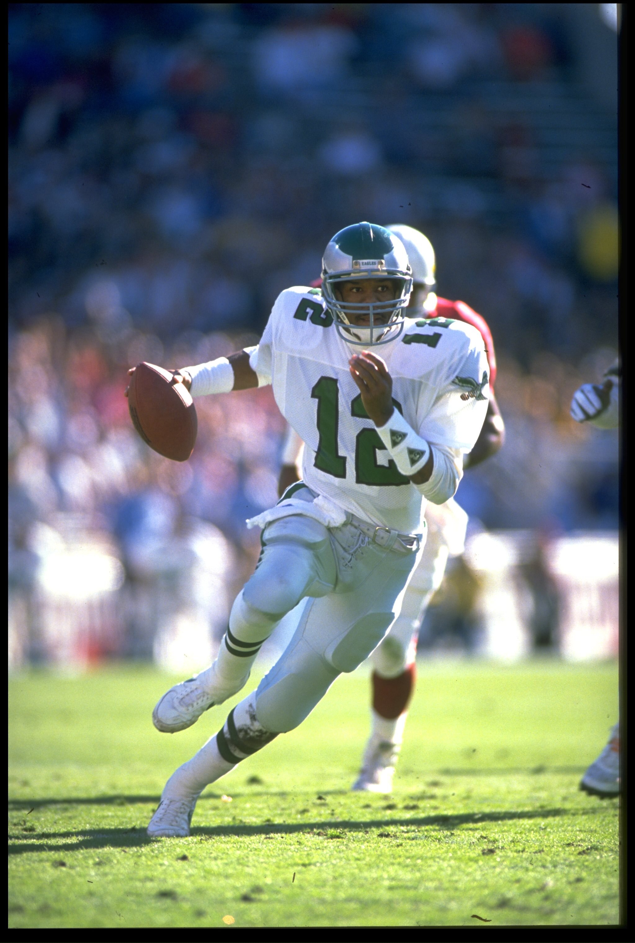 1990:  PHILADELPHIA EAGLES QUARTERBACK RANDALL CUNNINGHAM SCRAMBLES FOR EXTRA YARDAGE DURING THE EAGLES GAME VERSUS THE PHOENIX CARDINALS AT SUN DEVIL STADIUM IN TEMPE, ARIZONA.  MANDATORY CREDIT:  MIKE POWELL/ALLSPORT