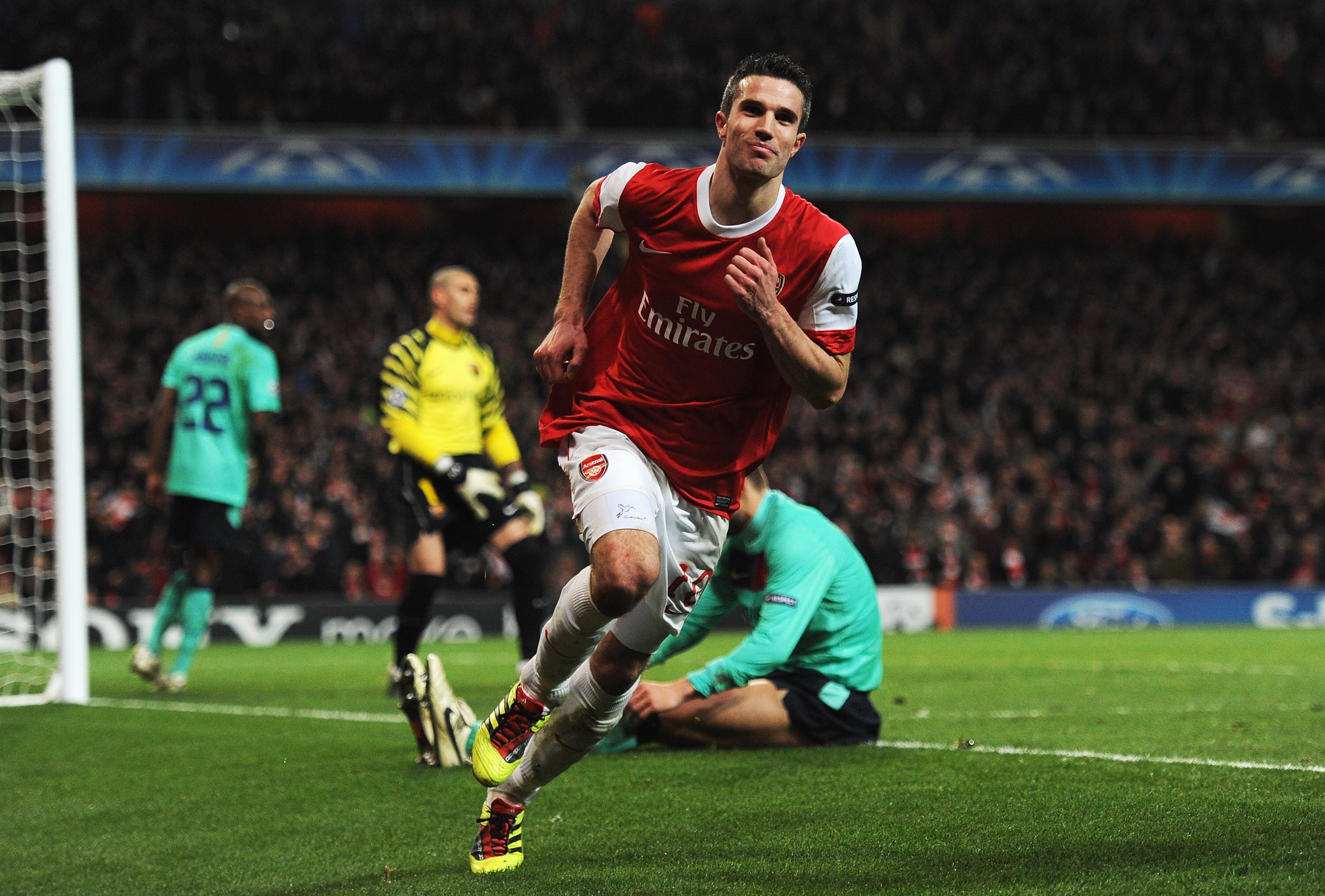 LONDON, ENGLAND - FEBRUARY 16:  Robin van Persie of Arsenal celebrates Arsenal's first goal during the UEFA Champions League round of 16 first leg match between Arsenal and Barcelona at the Emirates Stadium on February 16, 2011 in London, England.  (Photo