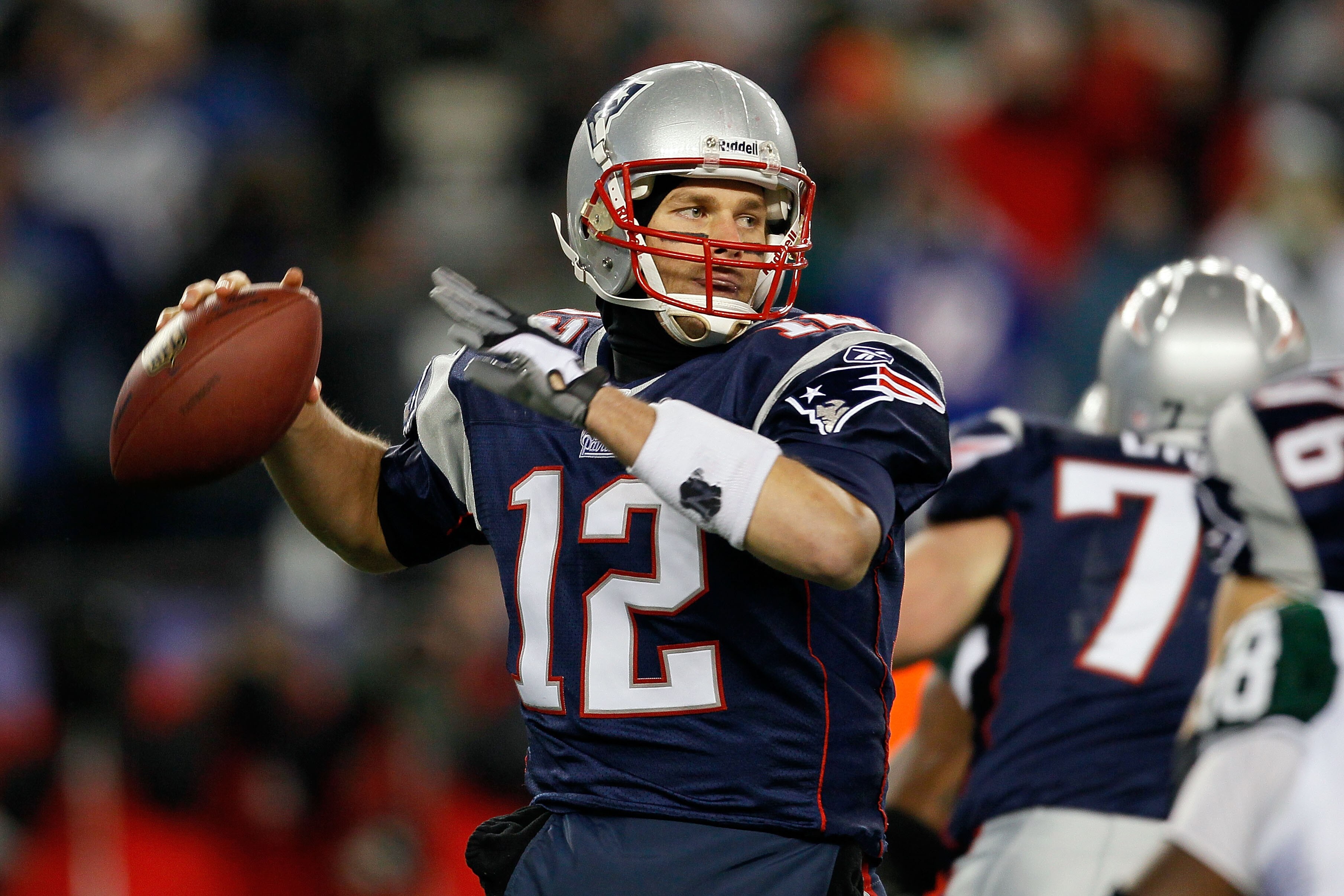 FOXBORO, MA - DECEMBER 06:  Tom Brady #12 of the New England Patriots throws a pass in the first half against the New York Jets at Gillette Stadium on December 6, 2010 in Foxboro, Massachusetts.  (Photo by Jim Rogash/Getty Images)
