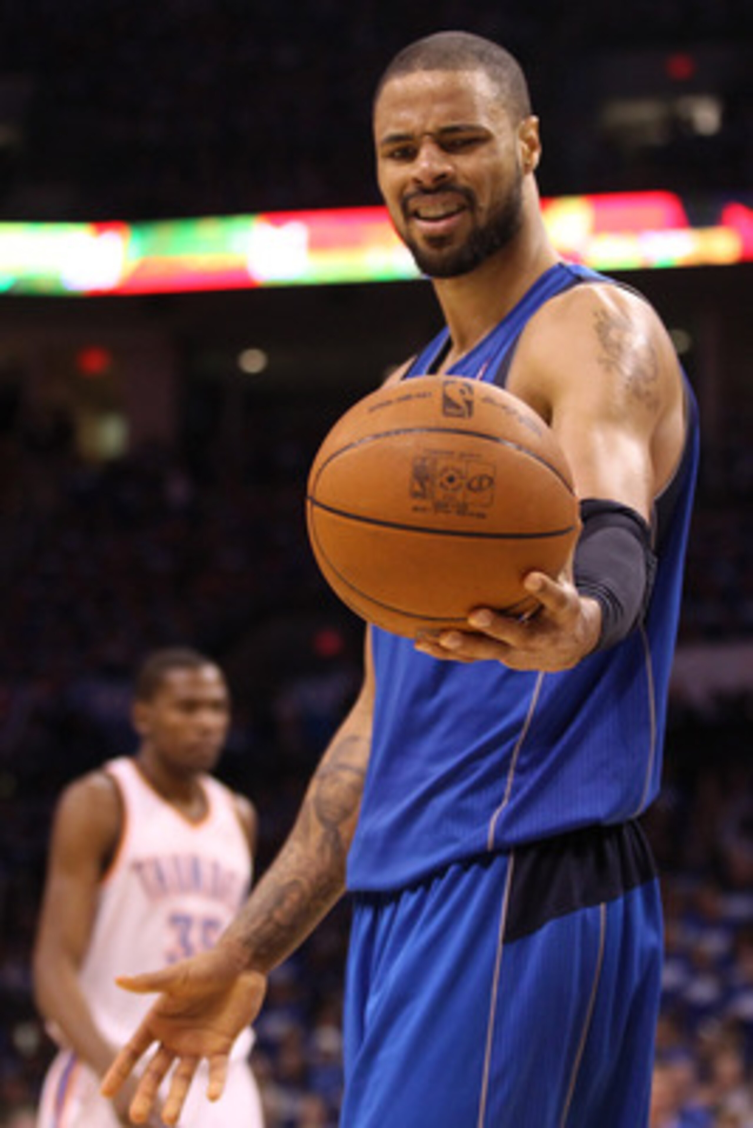 OKLAHOMA CITY, OK - MAY 21:  Tyson Chandler #6 of the Dallas Mavericks looks at the ball in the third quarter while taking on the Oklahoma City Thunder in Game Three of the Western Conference Finals during the 2011 NBA Playoffs at Oklahoma City Arena on M