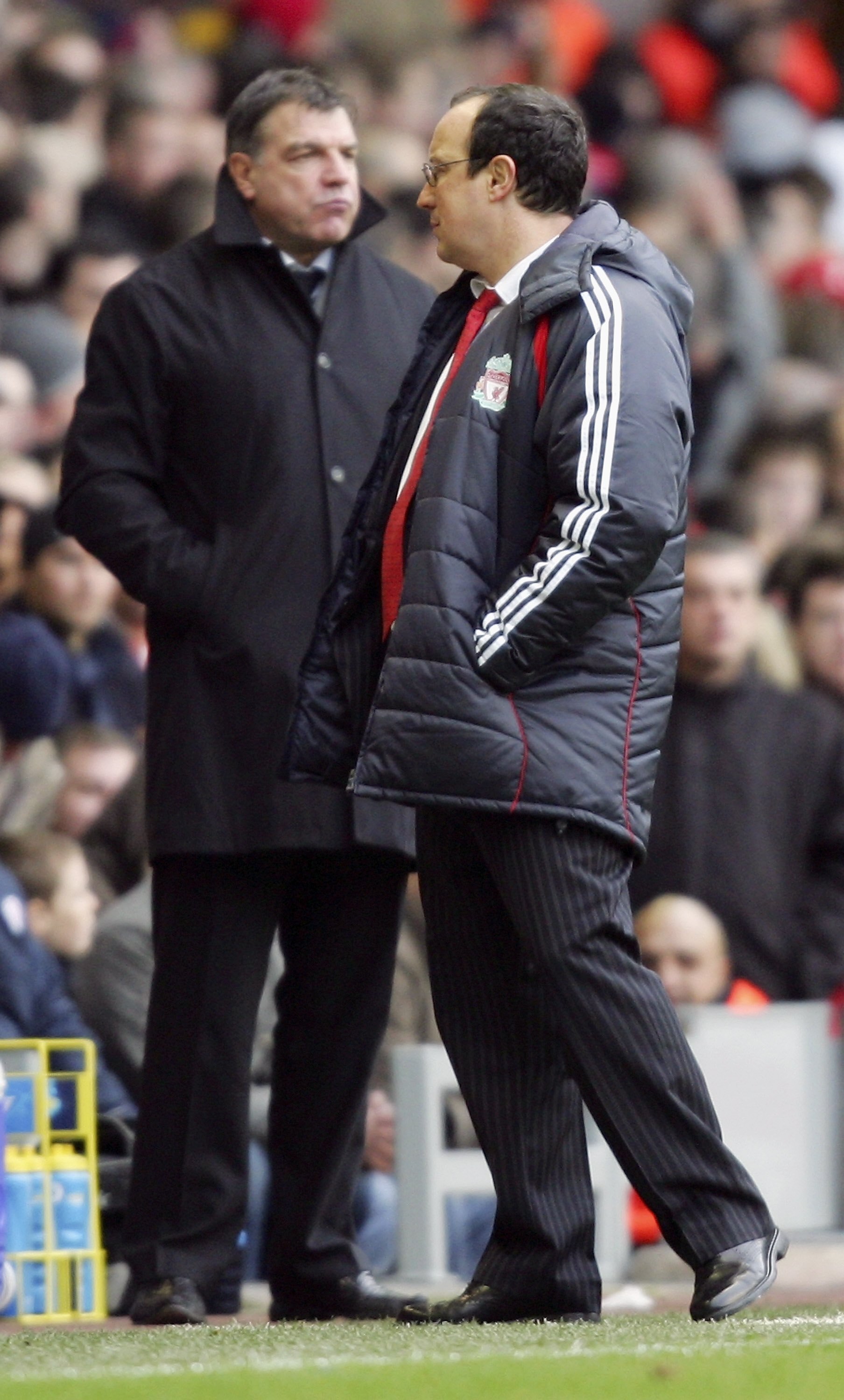 LIVERPOOL, UNITED KINGDOM - JANUARY 01:  Liverpool manager Rafael Benitez (R) and Sam Allardyce the manager of Bolton Wanderers watch the Barclays Premiership match between Liverpool and Bolton Wanderers at Anfield on January 1, 2007 in Liverpool, England