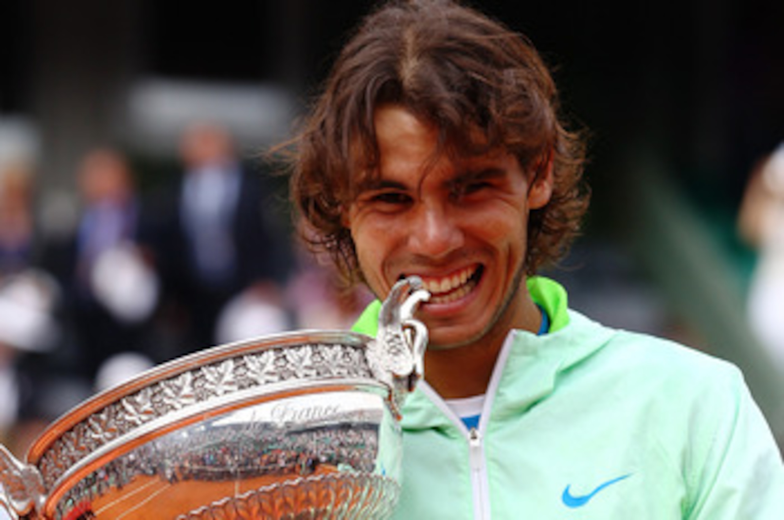 PARIS - JUNE 06:  Rafael Nadal of Spain celebrates with the trophy after winning the men's singles final match between Rafael Nadal of Spain and Robin Soderling of Sweden on day fifteen of the French Open at Roland Garros on June 6, 2010 in Paris, France.