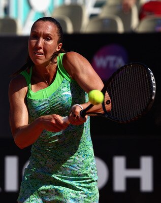 ROME, ITALY - MAY 13:  Jelena Jankovic of Serbia plays a backhand during her quarter final match against Caroline Wozniacki of Denmark during day six of the Internazoinali BNL D'Italia at the Foro Italico Tennis Centre  on May 13, 2011 in Rome, Italy.  (P