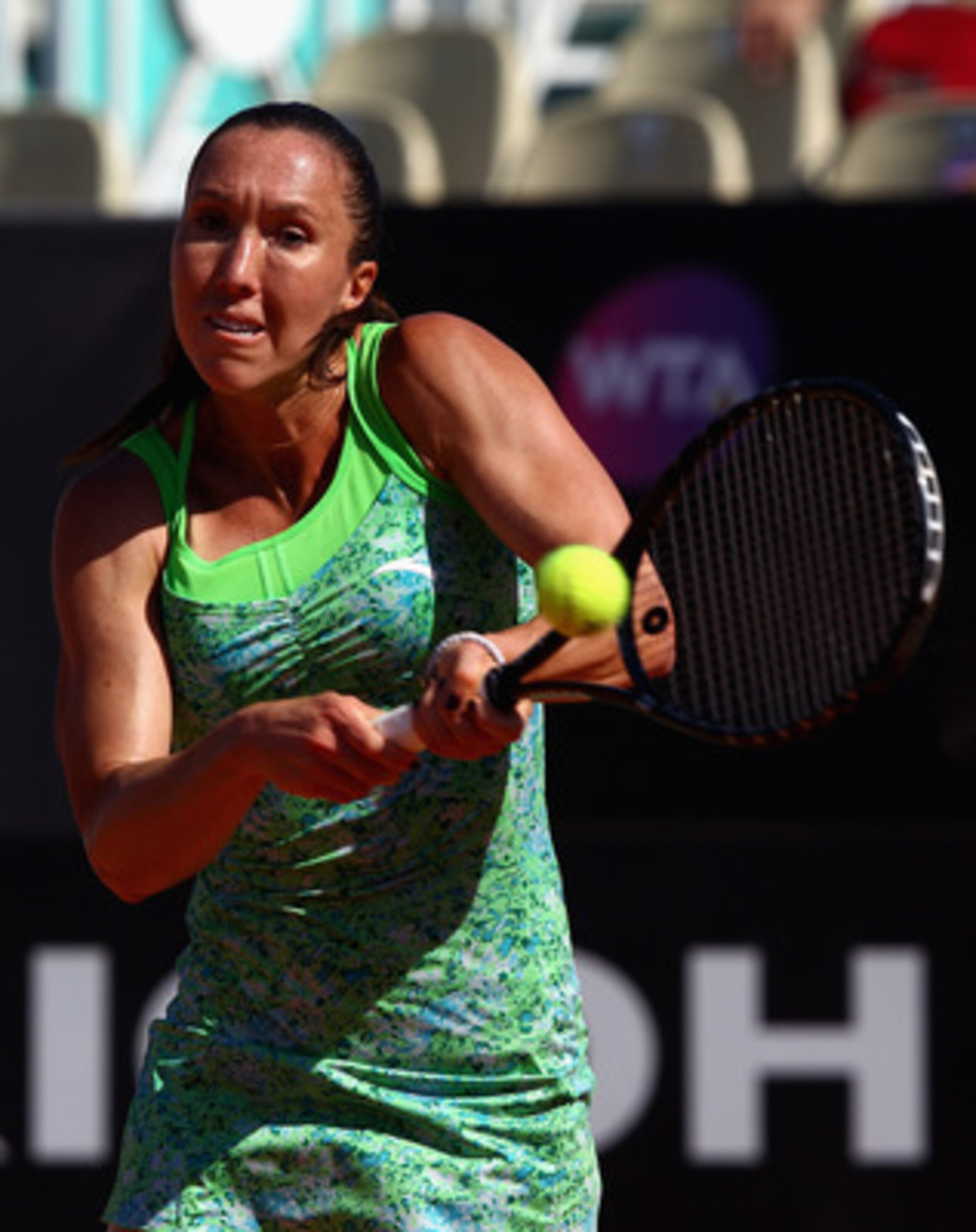 ROME, ITALY - MAY 13:  Jelena Jankovic of Serbia plays a backhand during her quarter final match against Caroline Wozniacki of Denmark during day six of the Internazoinali BNL D'Italia at the Foro Italico Tennis Centre  on May 13, 2011 in Rome, Italy.  (P