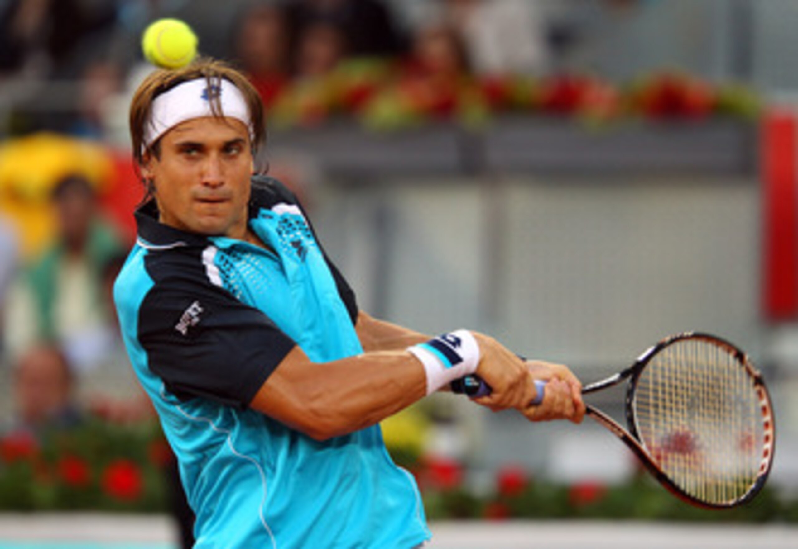 MADRID, SPAIN - MAY 03: David Ferrer of Spain in action in his match against Adrian Mannarino of France during day four of the Mutua Madrilena Madrid Open Tennis on May 3, 2011 in Madrid, Spain. (Photo by Julian Finney/Getty Images) MADRID, SPAIN - MAY 03: David Ferrer of Spain in action in his match against Adrian Mannarino of France during day four of the Mutua Madrilena Madrid Open Tennis on May 3, 2011 in Madrid, Spain. (Photo by Julian Finney/Getty Images)
