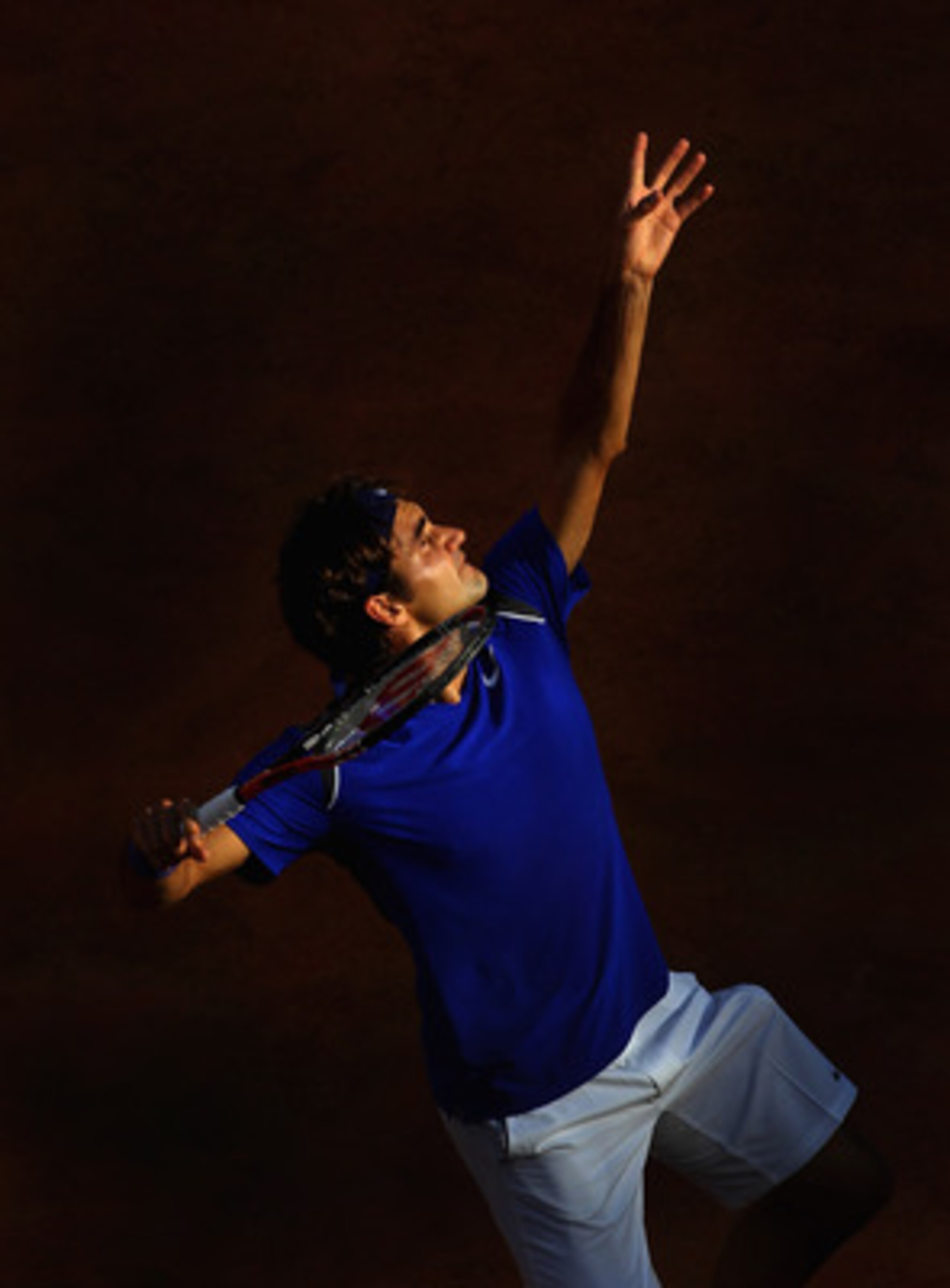 ROME, ITALY - MAY 12: Roger Federer of Switzerland serves during his third round match against Richard Gasquet of France during day five of the Internazionali BNL d'Italia at the Foro Italico Tennis Centre on May 12, 2011 in Rome, Italy. (Photo by Alex ROME, ITALY - MAY 12: Roger Federer of Switzerland serves during his third round match against Richard Gasquet of France during day five of the Internazionali BNL d'Italia at the Foro Italico Tennis Centre on May 12, 2011 in Rome, Italy. (Photo by Alex