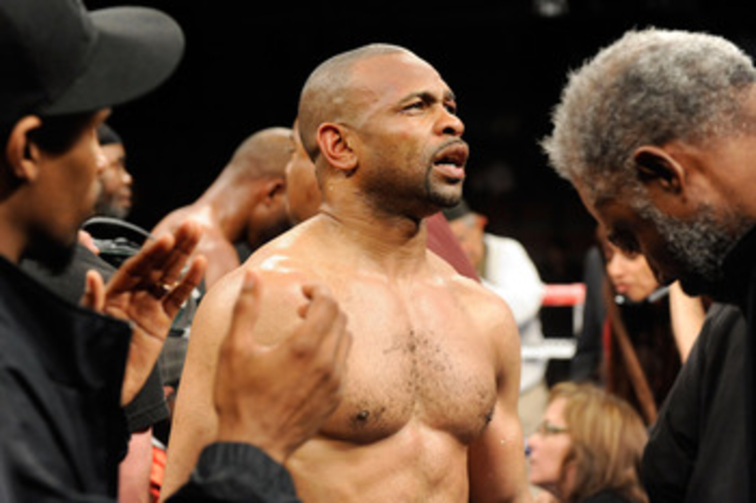 LAS VEGAS - APRIL 03:  Bernard Hopkins (R) reacts as his trainer Naazim Richardson takes his gloves off after Hopkins defeated Roy Jones Jr. in their light heavyweight bout by unanimous decision at the Mandalay Bay Events Center April 3, 2010 in Las Vegas