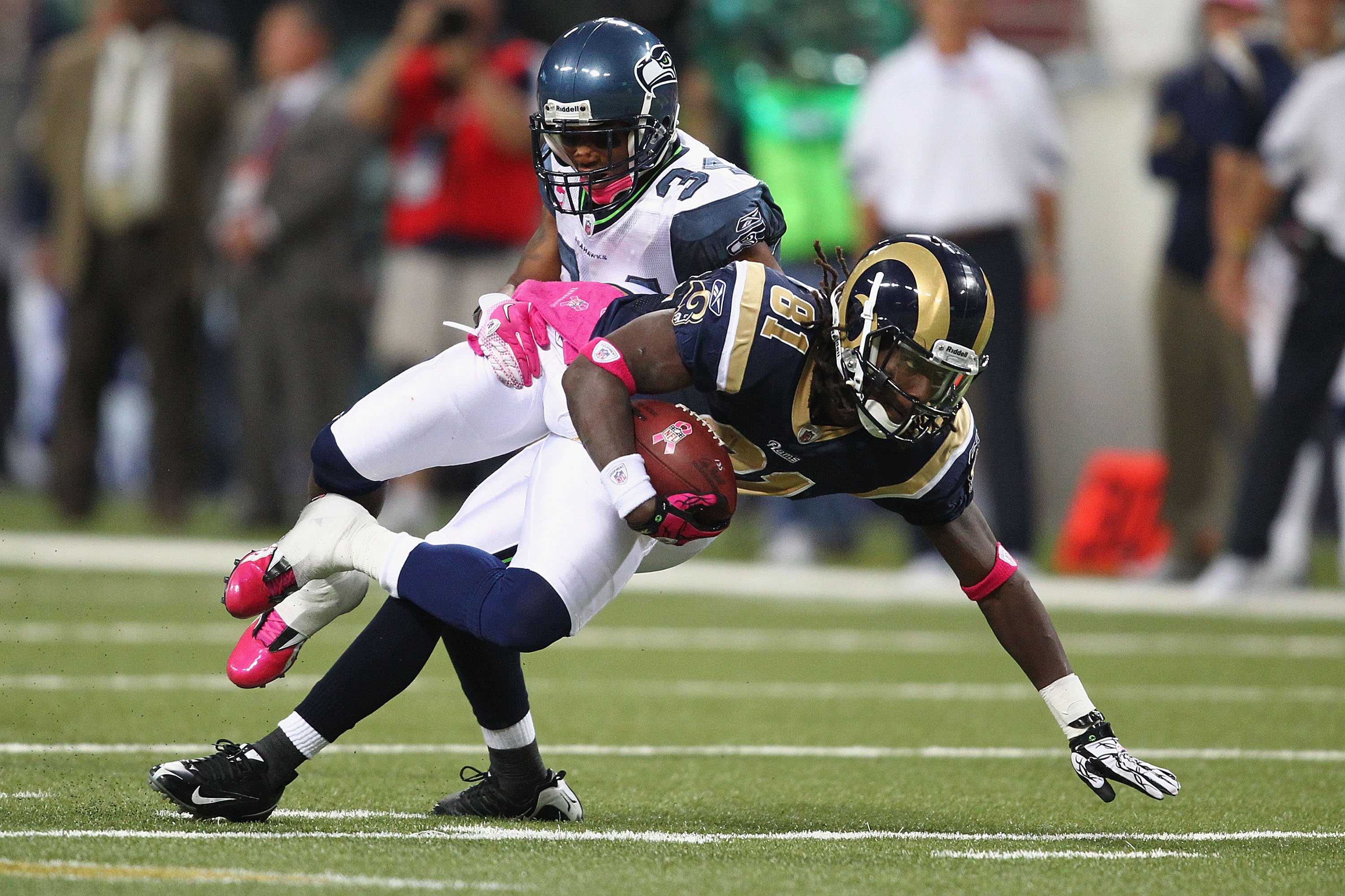 ST. LOUIS - OCTOBER 3: Mardy Gilyard #81of the St. Louis Rams is tackled by Roy Lewis #34 of the Seattle Seahawks at the Edward Jones Dome on October 3, 2010 in St. Louis, Missouri.  The Rams beat the Seahawks 20-3.  (Photo by Dilip Vishwanat/Getty Images